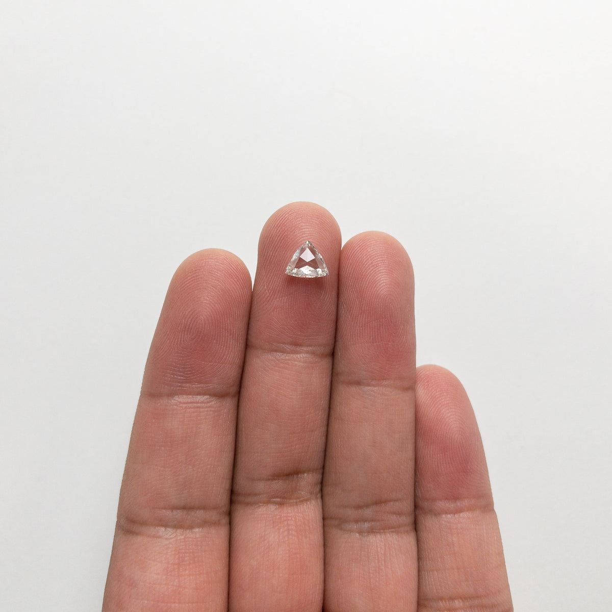 The 0.72ct 6.25x7.35x2.17mm SI1 H Trillion Rosecut 🇨🇦 21324-01 by East London jeweller Rachel Boston | Discover our collections of unique and timeless engagement rings, wedding rings, and modern fine jewellery.
