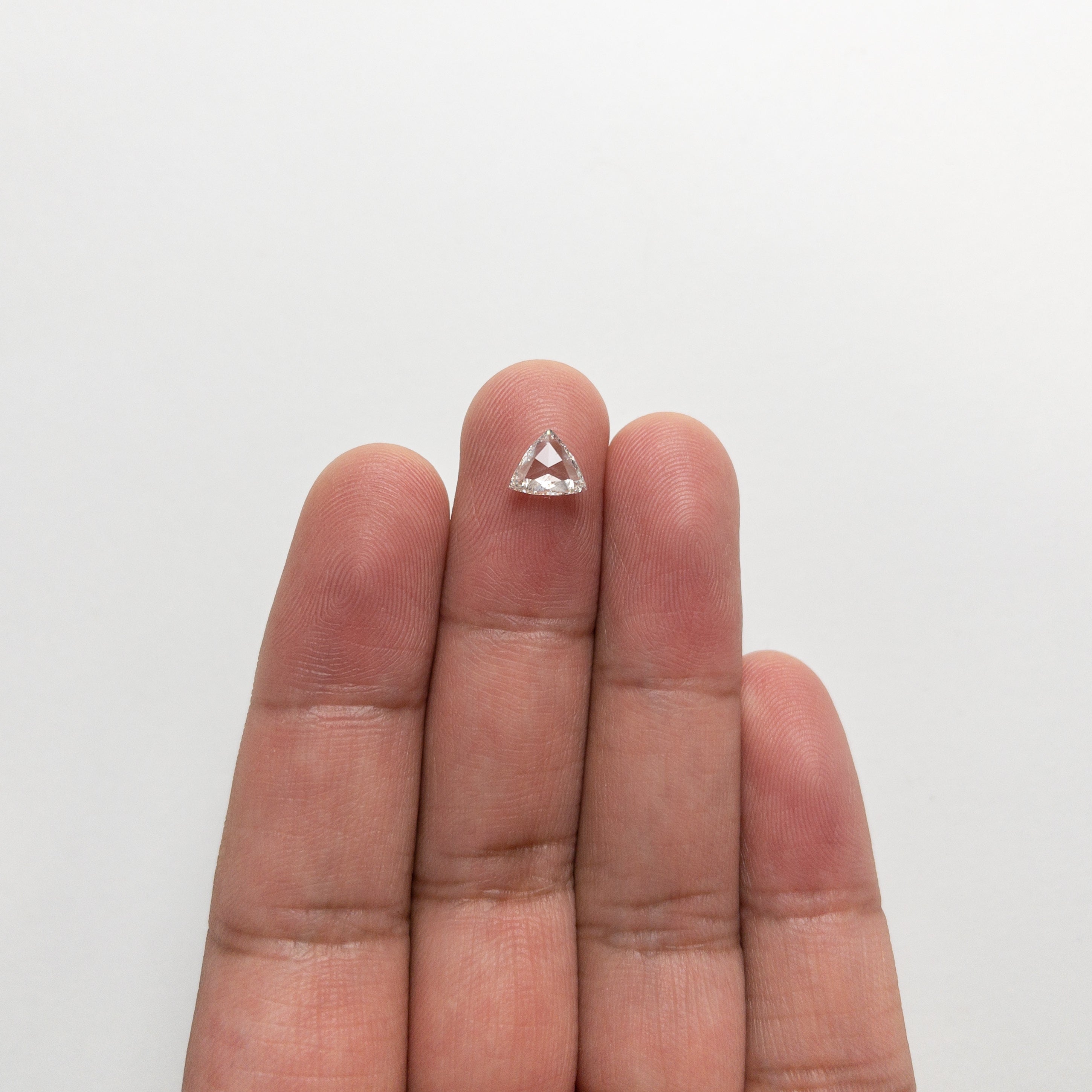 The 0.72ct 6.25x7.35x2.17mm SI1 H Trillion Rosecut 🇨🇦 21324-01 by East London jeweller Rachel Boston | Discover our collections of unique and timeless engagement rings, wedding rings, and modern fine jewellery.