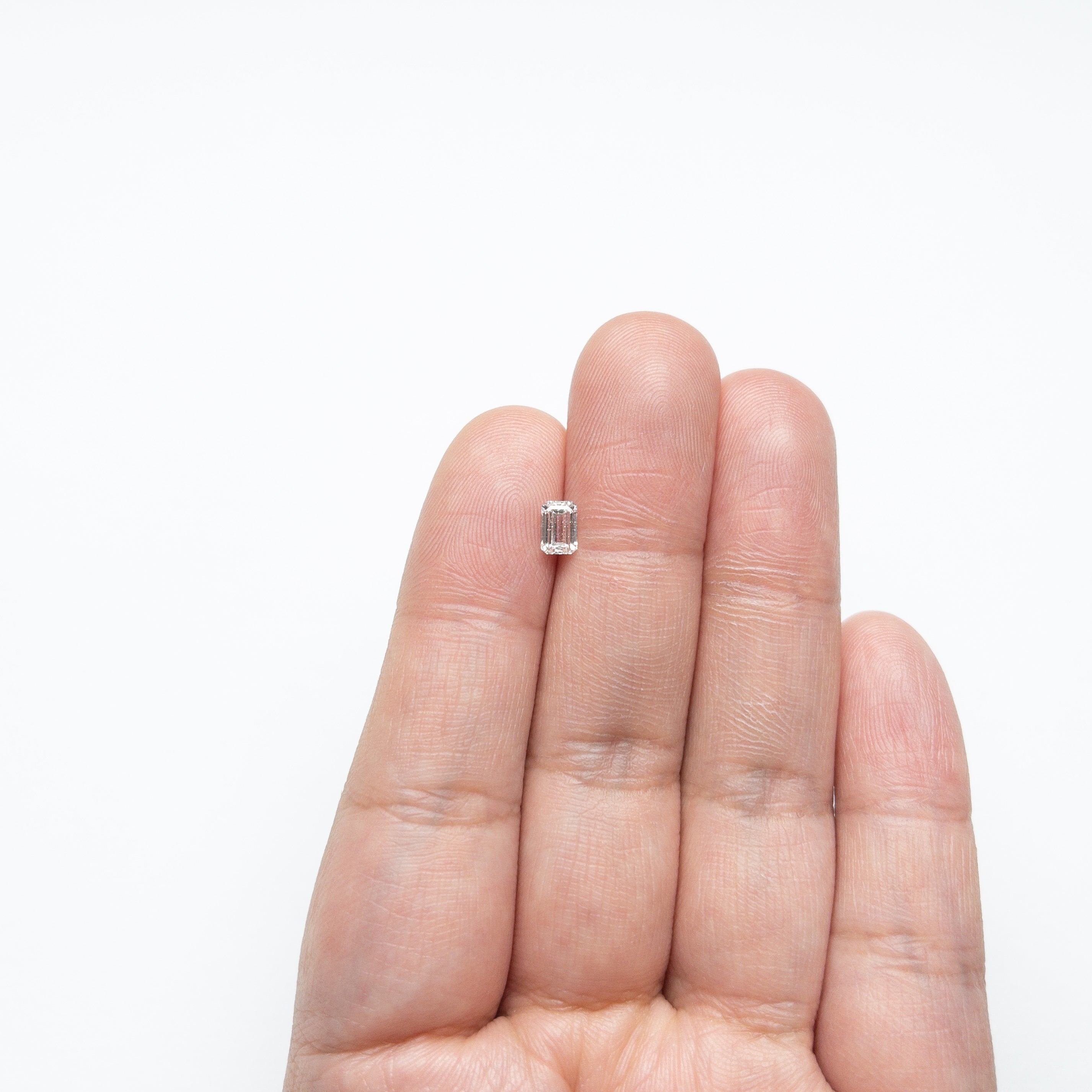 The 0.50ct 5.27x3.60x2.46mm I1 E Cut Corner Rectangle Step Cut 🇨🇦 21415-01 by East London jeweller Rachel Boston | Discover our collections of unique and timeless engagement rings, wedding rings, and modern fine jewellery.