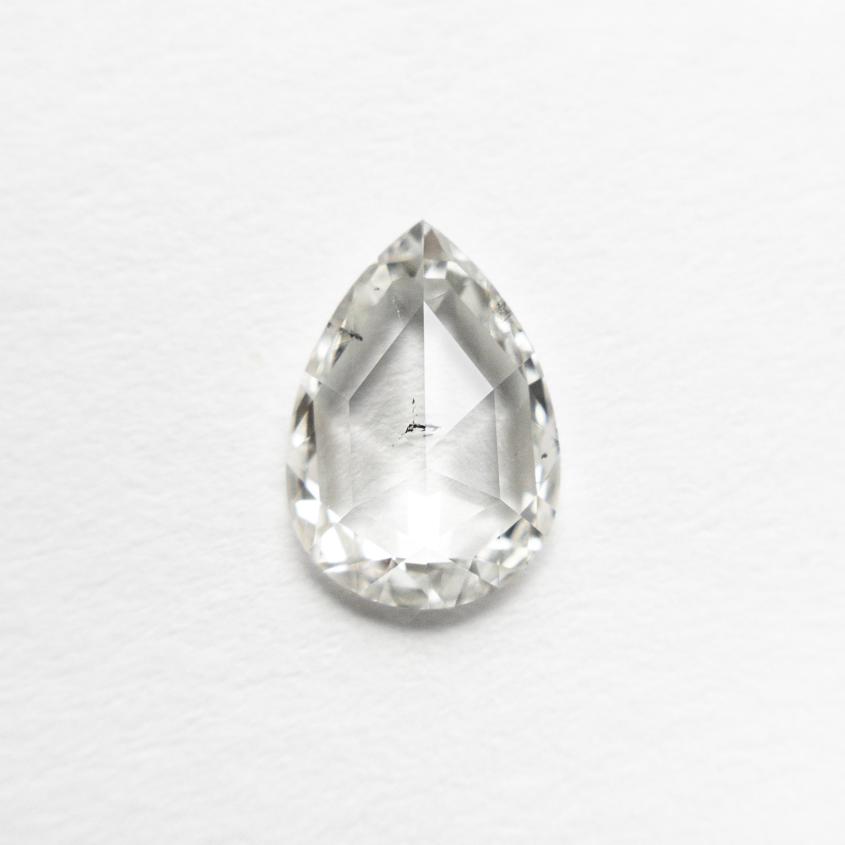 The 0.70ct 8.06x5.74x1.83mm I1 I Pear Rosecut 🇨🇦 21480-01 by East London jeweller Rachel Boston | Discover our collections of unique and timeless engagement rings, wedding rings, and modern fine jewellery.