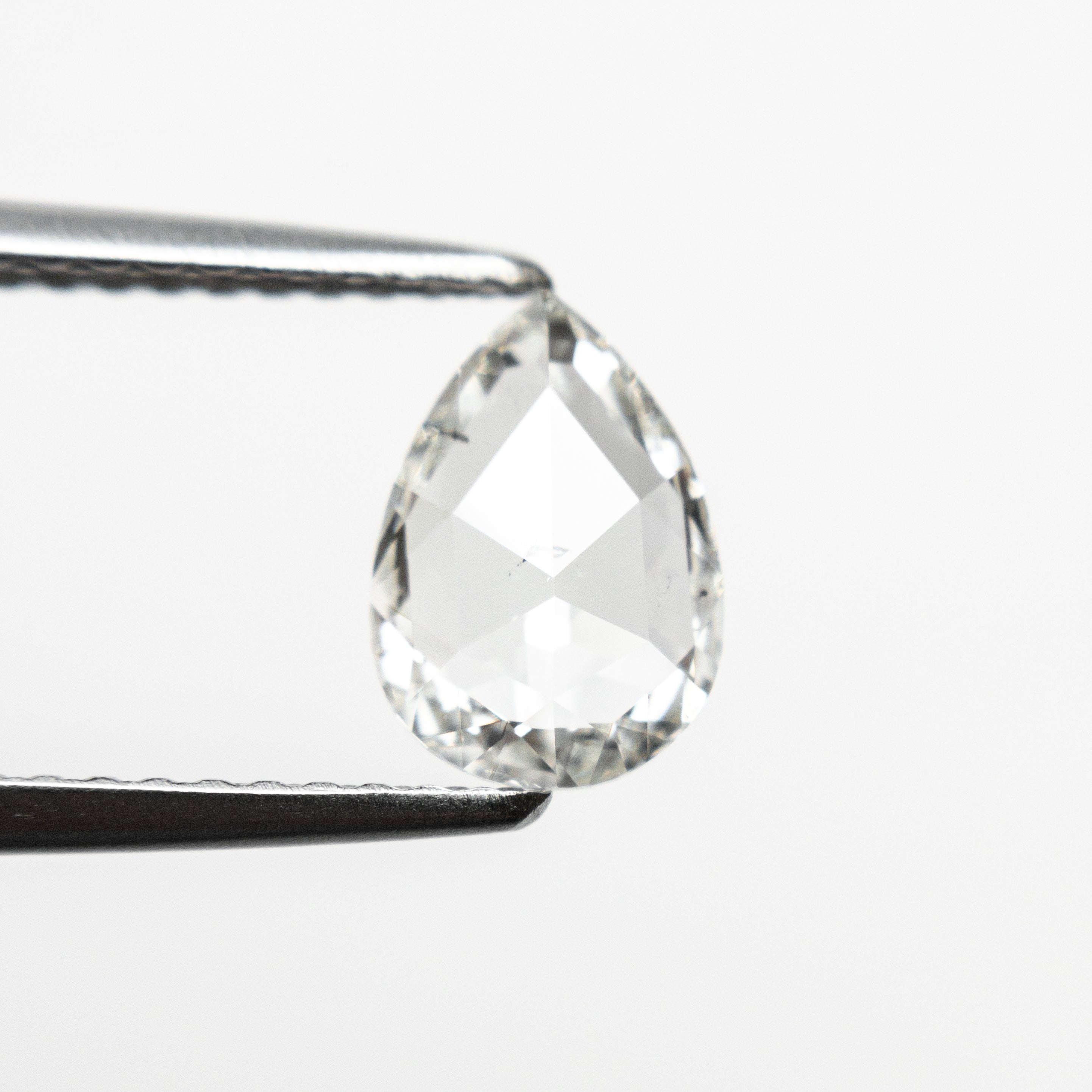 The 0.70ct 8.06x5.74x1.83mm I1 I Pear Rosecut 🇨🇦 21480-01 by East London jeweller Rachel Boston | Discover our collections of unique and timeless engagement rings, wedding rings, and modern fine jewellery.