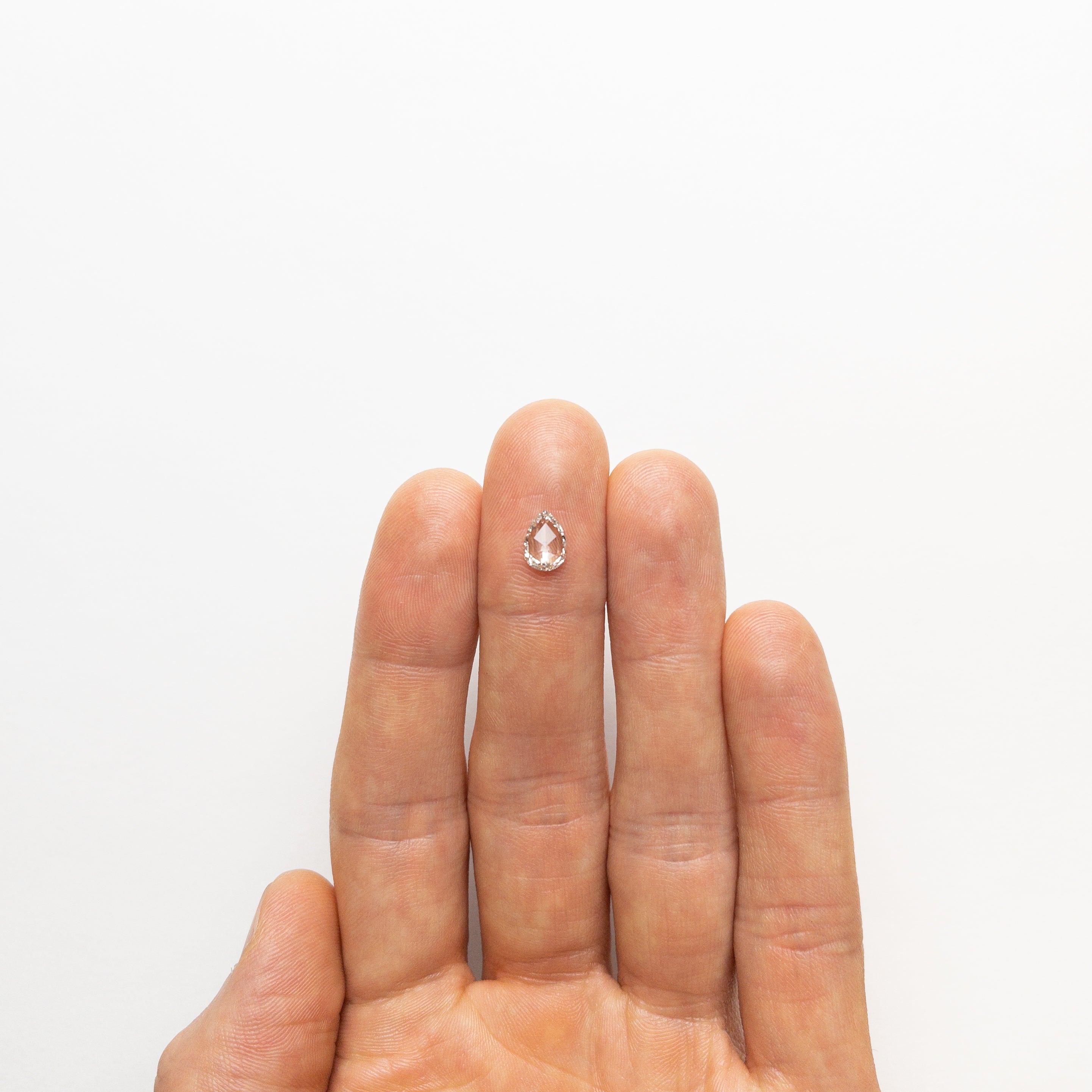 The 0.70ct 8.06x5.74x1.83mm I1 I Pear Rosecut 🇨🇦 21480-01 by East London jeweller Rachel Boston | Discover our collections of unique and timeless engagement rings, wedding rings, and modern fine jewellery.