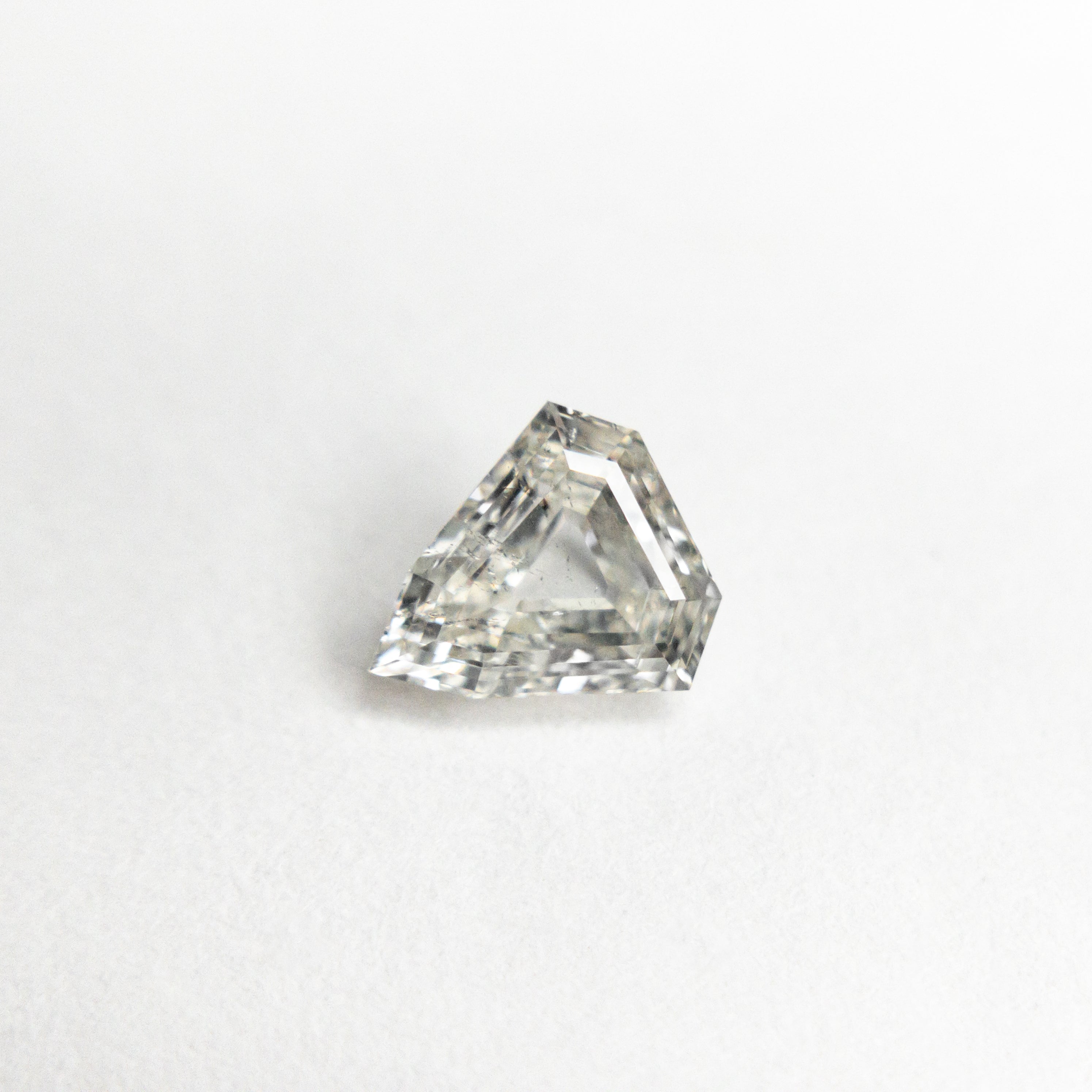 The 0.52ct 5.80x5.37x2.35mm I1 J Shield Step Cut 🇨🇦 21488-01 by East London jeweller Rachel Boston | Discover our collections of unique and timeless engagement rings, wedding rings, and modern fine jewellery.