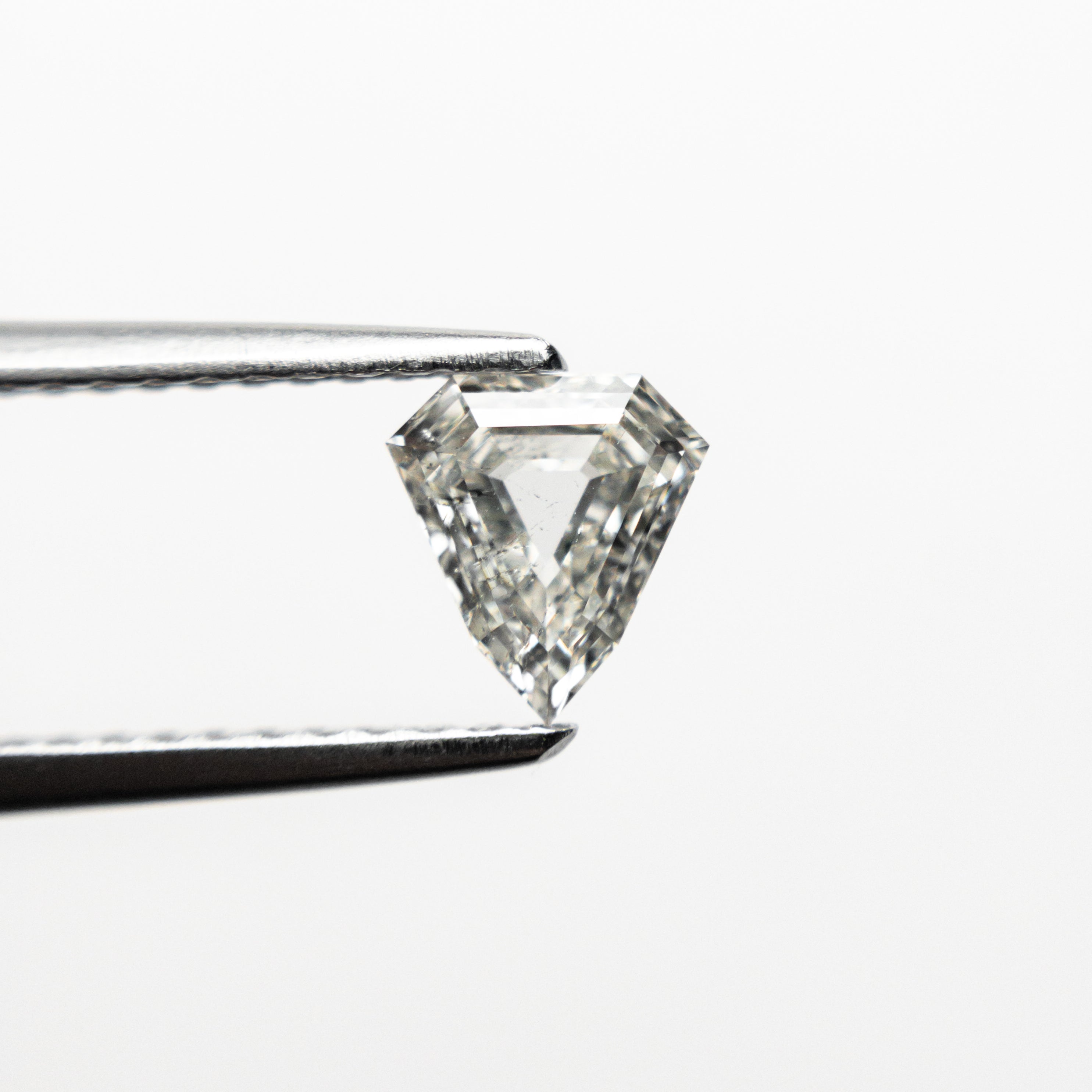 The 0.52ct 5.80x5.37x2.35mm I1 J Shield Step Cut 🇨🇦 21488-01 by East London jeweller Rachel Boston | Discover our collections of unique and timeless engagement rings, wedding rings, and modern fine jewellery.