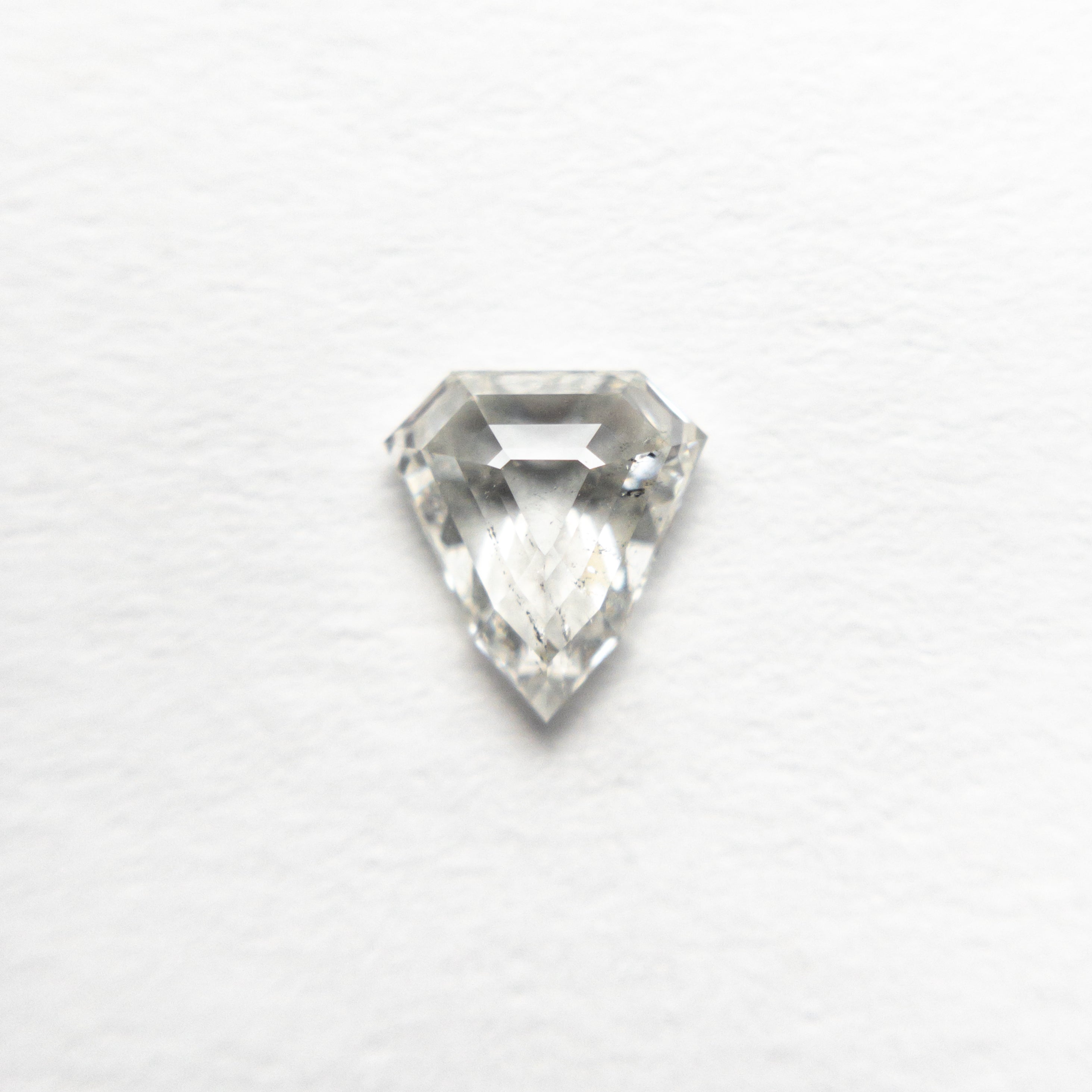 The 0.52ct 5.80x5.37x2.35mm I1 J Shield Step Cut 🇨🇦 21488-01 by East London jeweller Rachel Boston | Discover our collections of unique and timeless engagement rings, wedding rings, and modern fine jewellery.