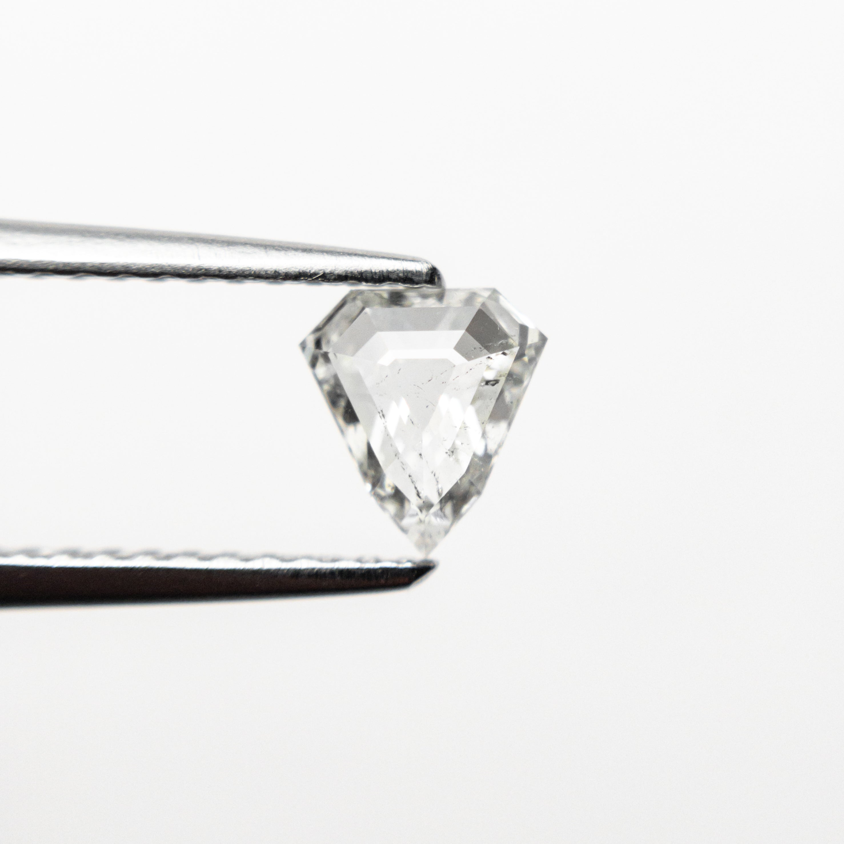 The 0.52ct 5.80x5.37x2.35mm I1 J Shield Step Cut 🇨🇦 21488-01 by East London jeweller Rachel Boston | Discover our collections of unique and timeless engagement rings, wedding rings, and modern fine jewellery.
