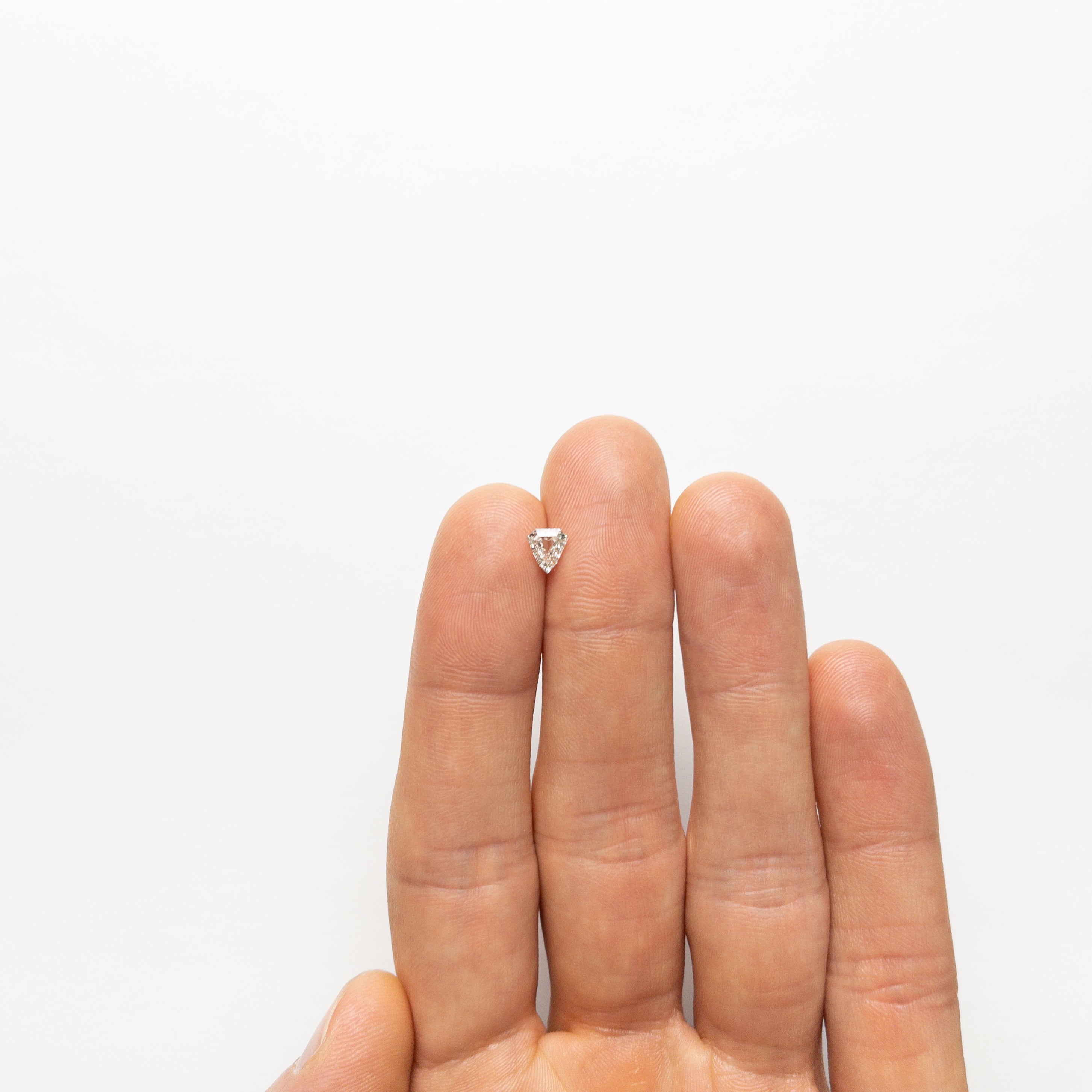 The 0.52ct 5.80x5.37x2.35mm I1 J Shield Step Cut 🇨🇦 21488-01 by East London jeweller Rachel Boston | Discover our collections of unique and timeless engagement rings, wedding rings, and modern fine jewellery.