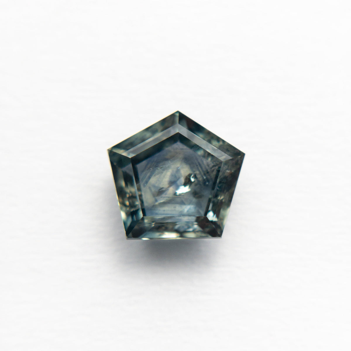 The 1.72ct 7.16x6.63x3.43mm Pentagon Double Cut Sapphire 21592-10 by East London jeweller Rachel Boston | Discover our collections of unique and timeless engagement rings, wedding rings, and modern fine jewellery.