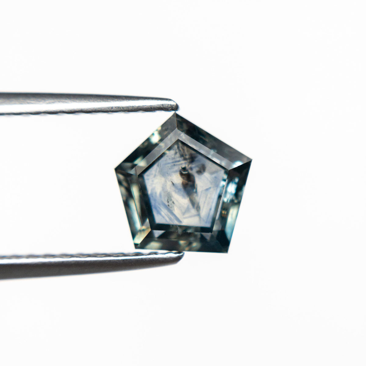 The 1.72ct 7.16x6.63x3.43mm Pentagon Double Cut Sapphire 21592-10 by East London jeweller Rachel Boston | Discover our collections of unique and timeless engagement rings, wedding rings, and modern fine jewellery.