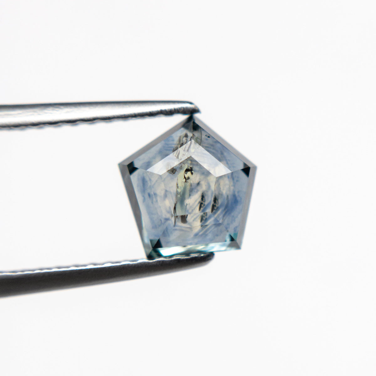 The 1.72ct 7.16x6.63x3.43mm Pentagon Double Cut Sapphire 21592-10 by East London jeweller Rachel Boston | Discover our collections of unique and timeless engagement rings, wedding rings, and modern fine jewellery.