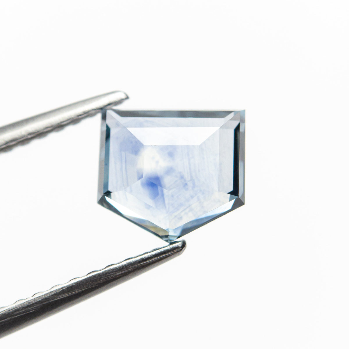 The 1.36ct 6.70x6.20x2.68mm Shield Rosecut Sapphire 21603-03 by East London jeweller Rachel Boston | Discover our collections of unique and timeless engagement rings, wedding rings, and modern fine jewellery.