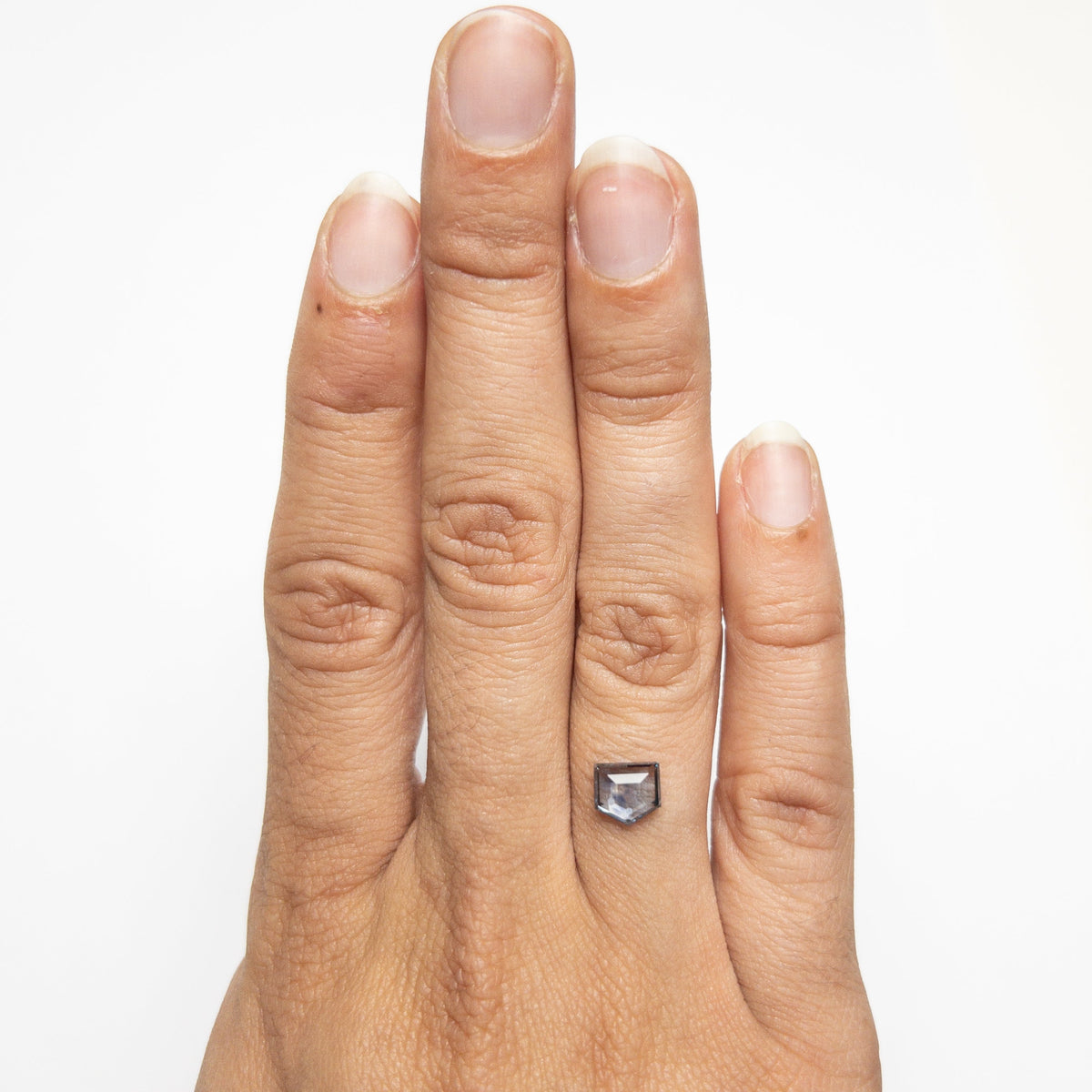 The 1.36ct 6.70x6.20x2.68mm Shield Rosecut Sapphire 21603-03 by East London jeweller Rachel Boston | Discover our collections of unique and timeless engagement rings, wedding rings, and modern fine jewellery.