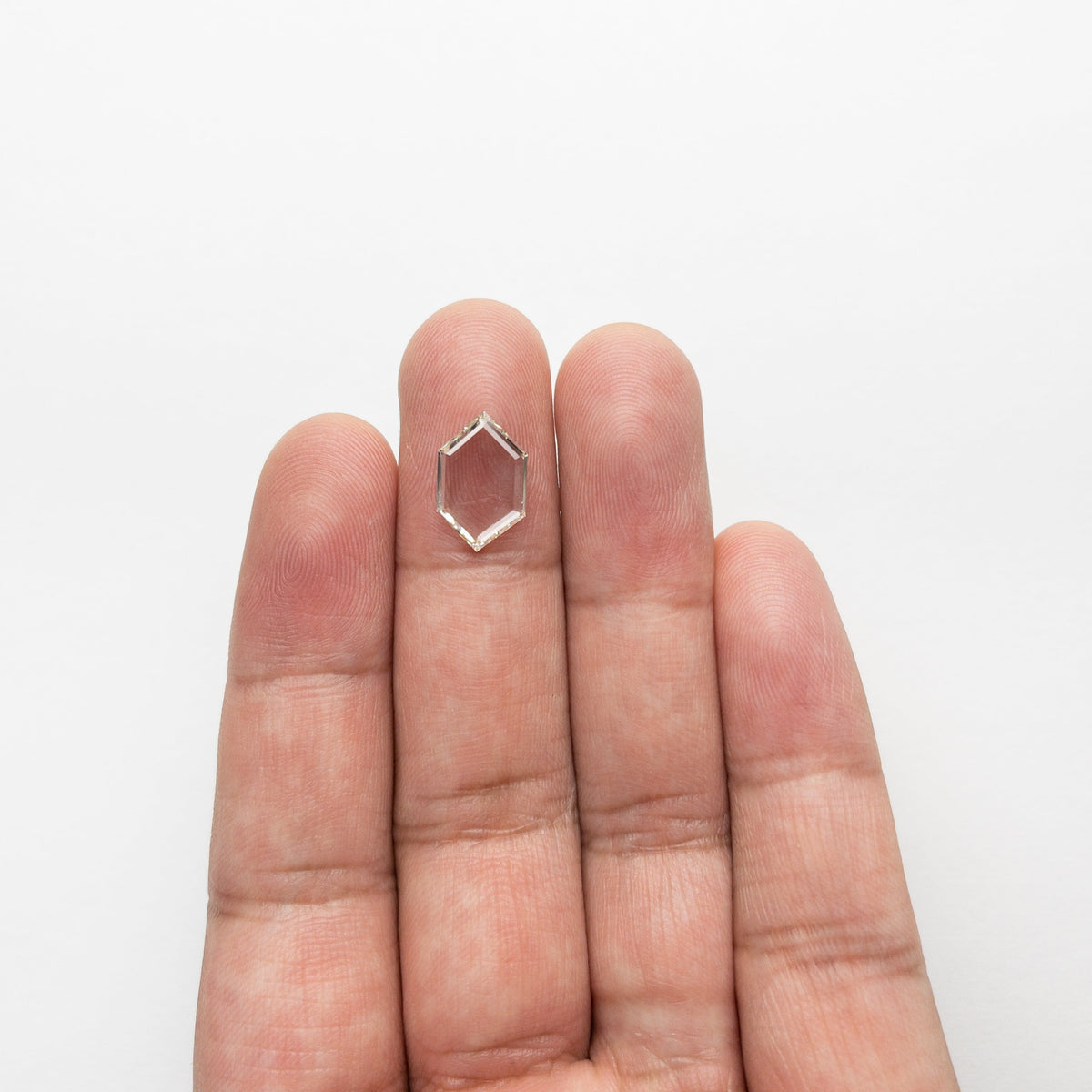 The 2.37ct 13.28x8.43x2.07mm SI2 L Hexagon Portrait Cut 21688-01 by East London jeweller Rachel Boston | Discover our collections of unique and timeless engagement rings, wedding rings, and modern fine jewellery.