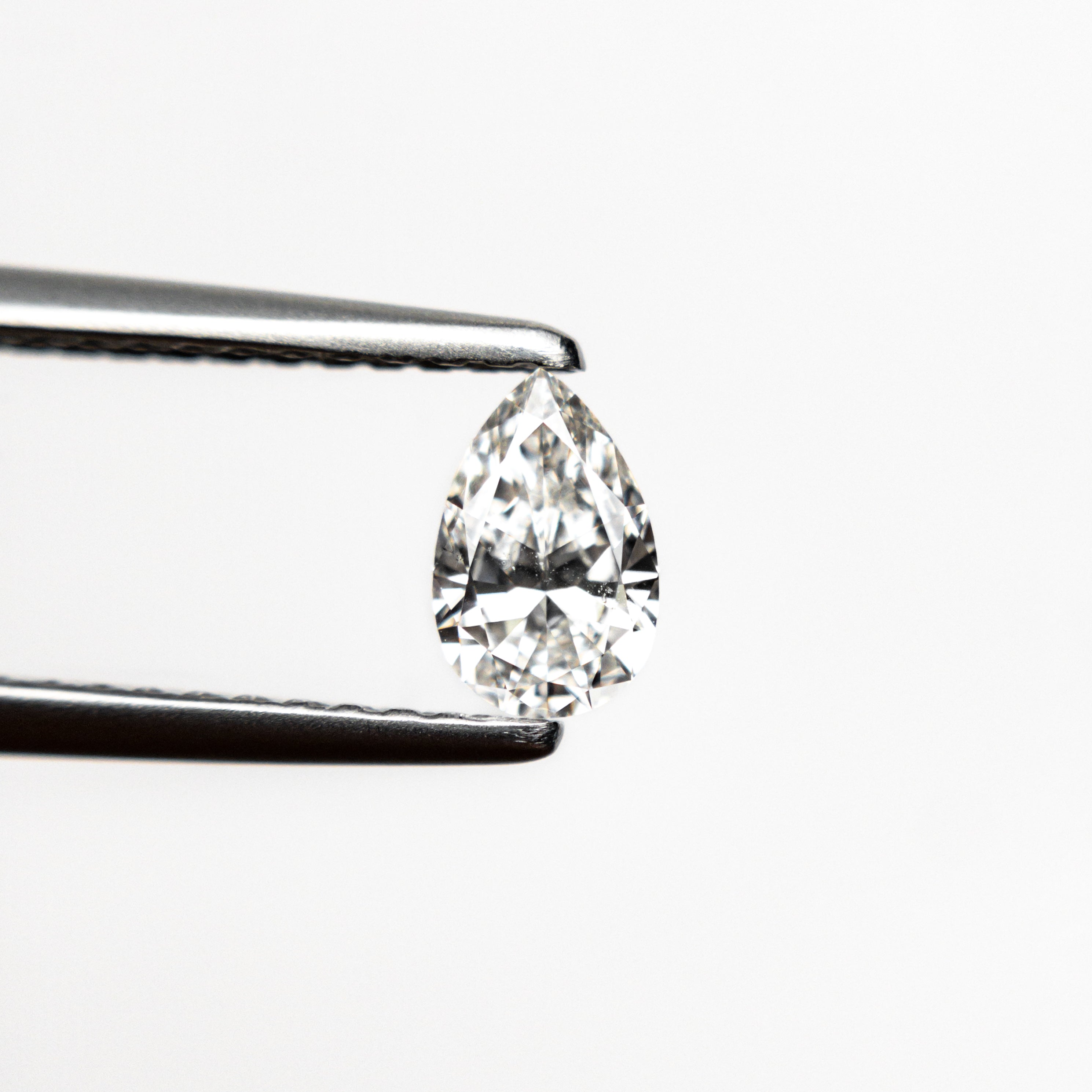 The 0.31ct 5.78x3.75x2.22mm SI1 E Pear Brilliant 🇨🇦 21912-03 by East London jeweller Rachel Boston | Discover our collections of unique and timeless engagement rings, wedding rings, and modern fine jewellery.