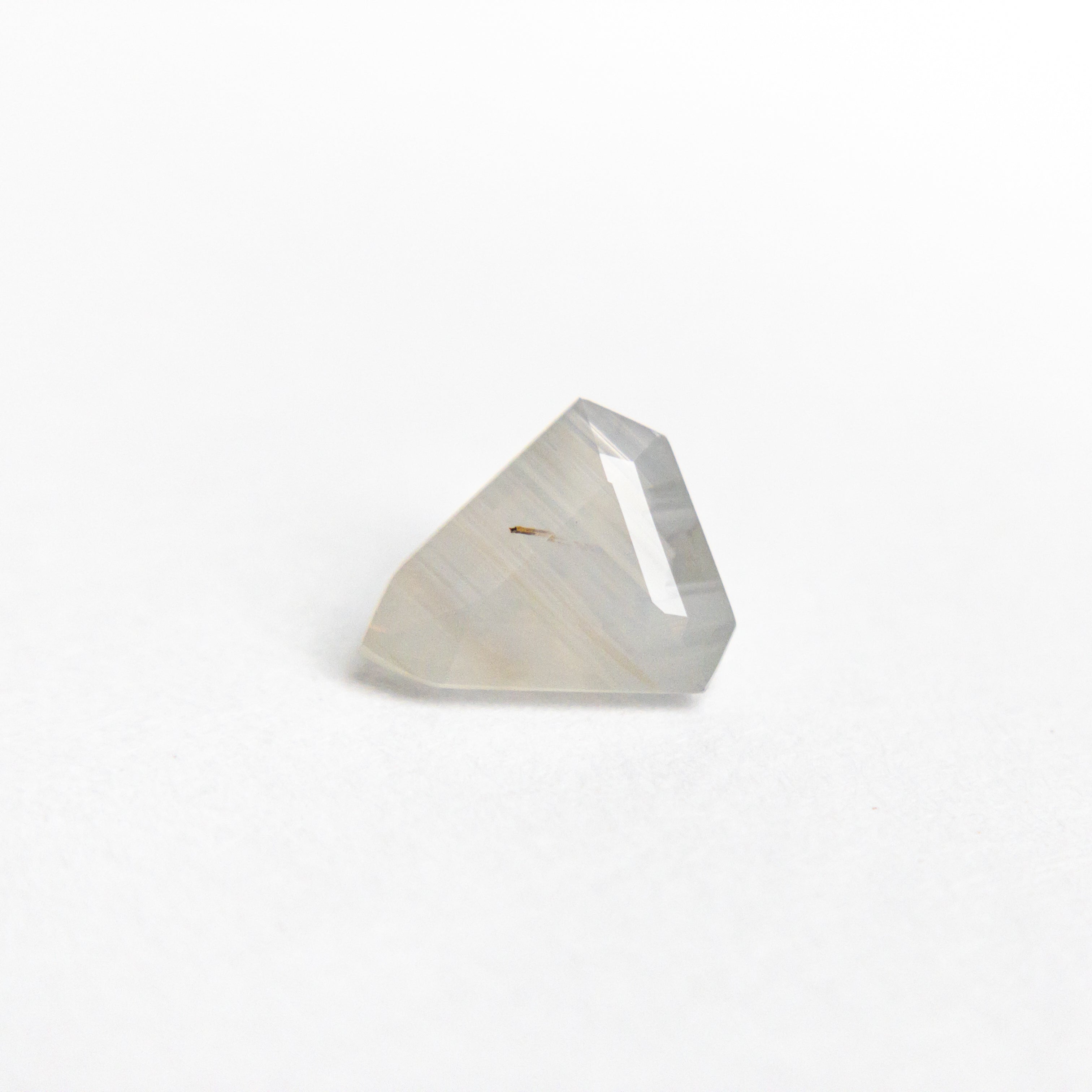 The 0.68ct 6.17x5.37x3.17mm Shield Step Cut Sapphire 21990-01 by East London jeweller Rachel Boston | Discover our collections of unique and timeless engagement rings, wedding rings, and modern fine jewellery.
