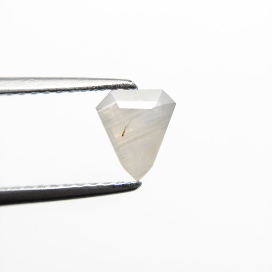 The 0.68ct 6.17x5.37x3.17mm Shield Step Cut Sapphire 21990-01 by East London jeweller Rachel Boston | Discover our collections of unique and timeless engagement rings, wedding rings, and modern fine jewellery. - Rachel Boston Jewellery