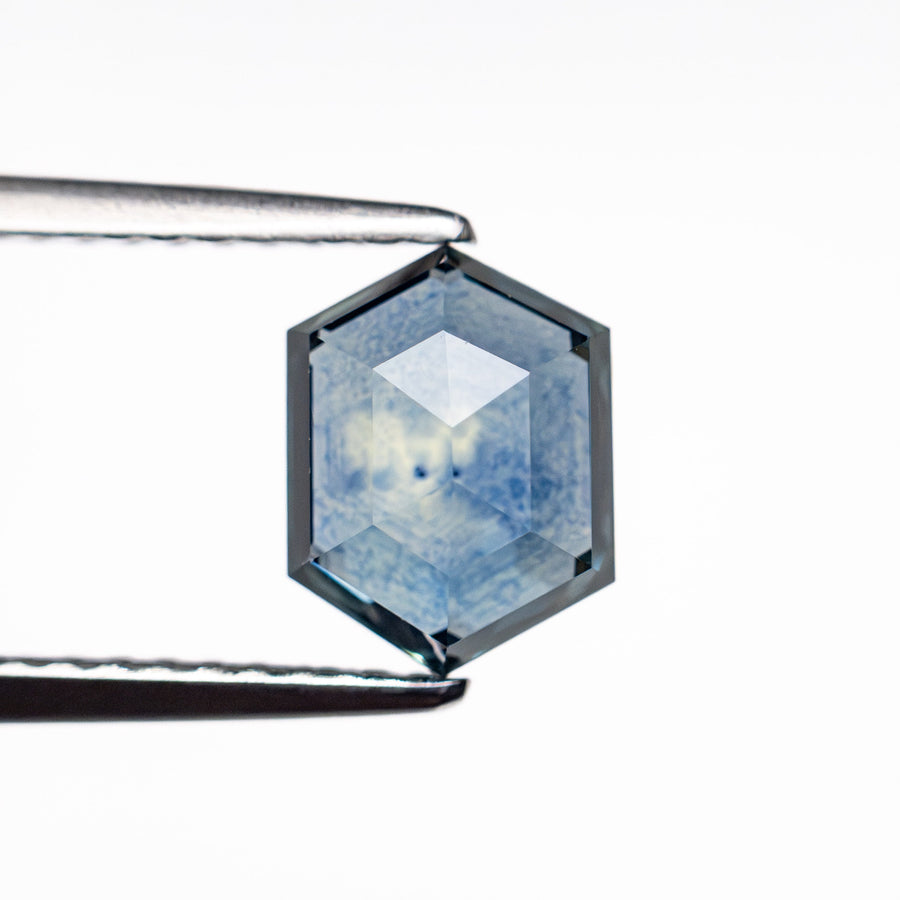 The 1.61ct 7.81x5.93x3.23mm Hexagon Step Cut Sapphire 22266-27 by East London jeweller Rachel Boston | Discover our collections of unique and timeless engagement rings, wedding rings, and modern fine jewellery. - Rachel Boston Jewellery