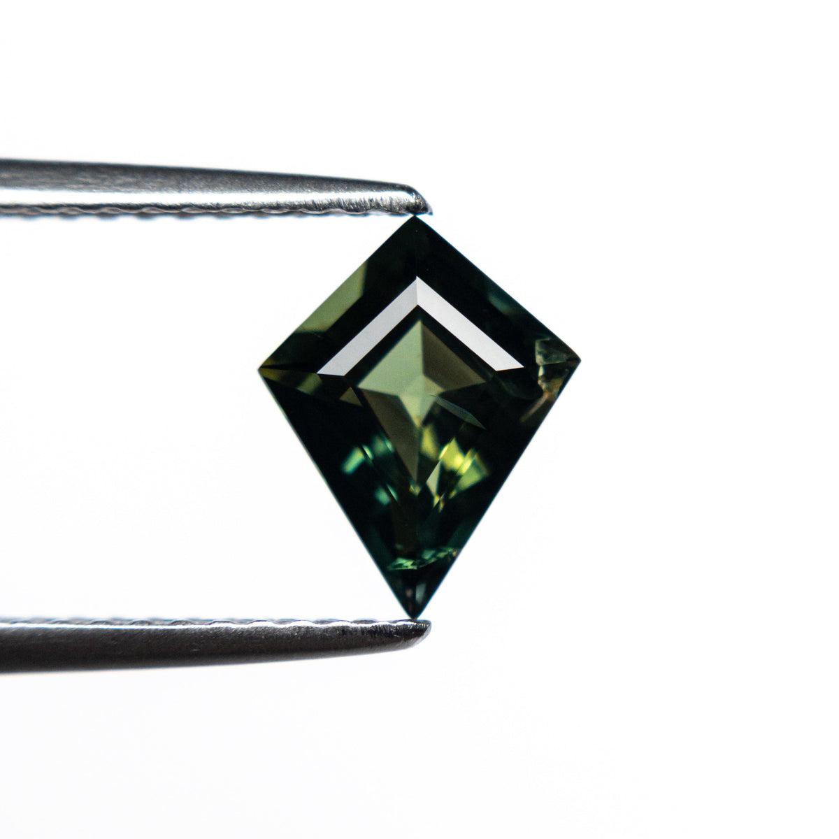 The 1.23ct 8.80x7.05x3.80mm Kite Step Cut Sapphire 22270-01 by East London jeweller Rachel Boston | Discover our collections of unique and timeless engagement rings, wedding rings, and modern fine jewellery.