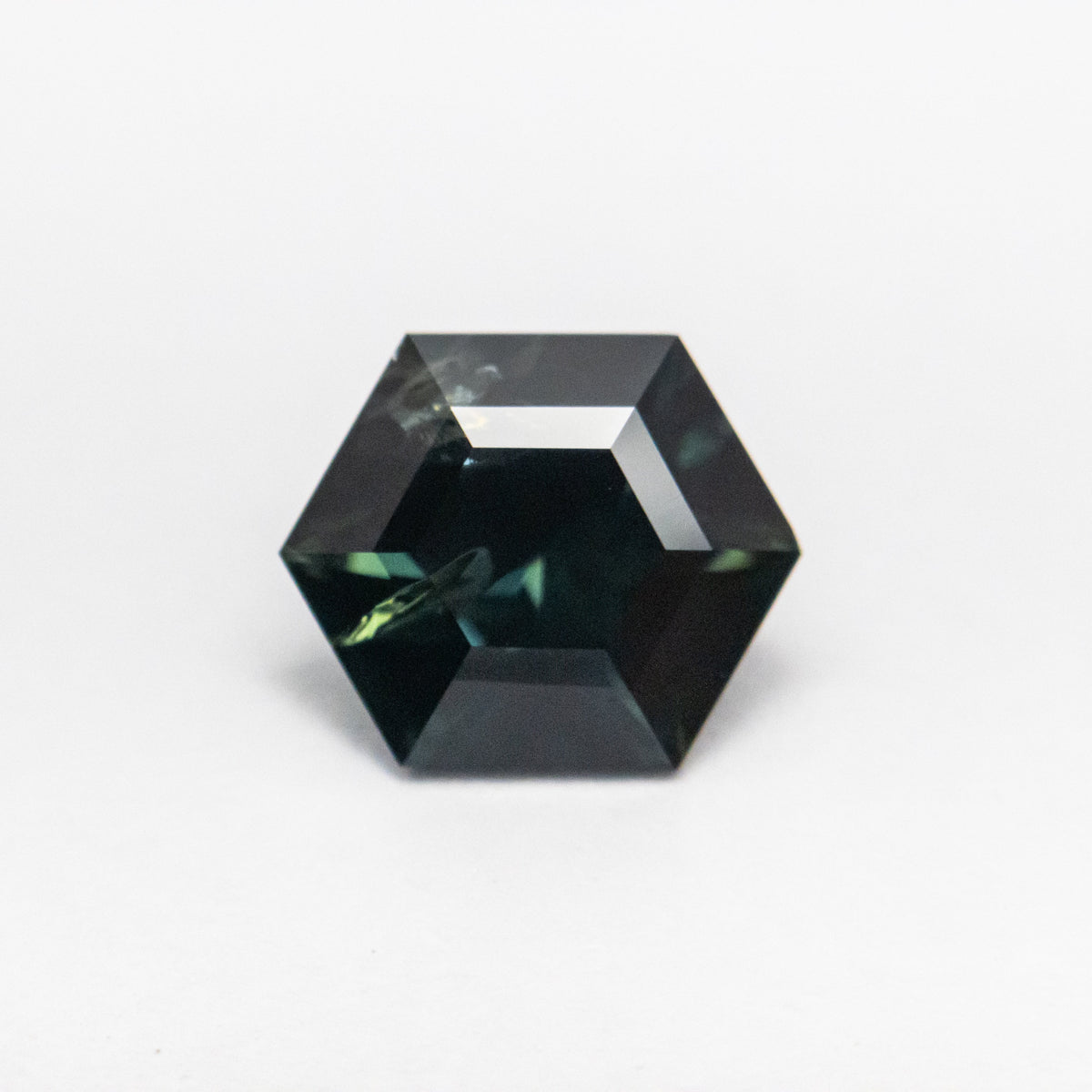 The 1.54ct 8.03x6.67x4.12mm Hexagon Step Cut Sapphire 22314-04 by East London jeweller Rachel Boston | Discover our collections of unique and timeless engagement rings, wedding rings, and modern fine jewellery.