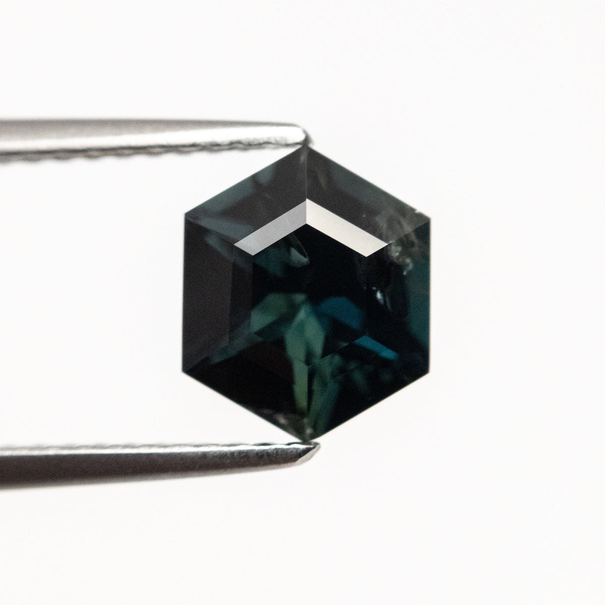 The 1.54ct 8.03x6.67x4.12mm Hexagon Step Cut Sapphire 22314-04 by East London jeweller Rachel Boston | Discover our collections of unique and timeless engagement rings, wedding rings, and modern fine jewellery.