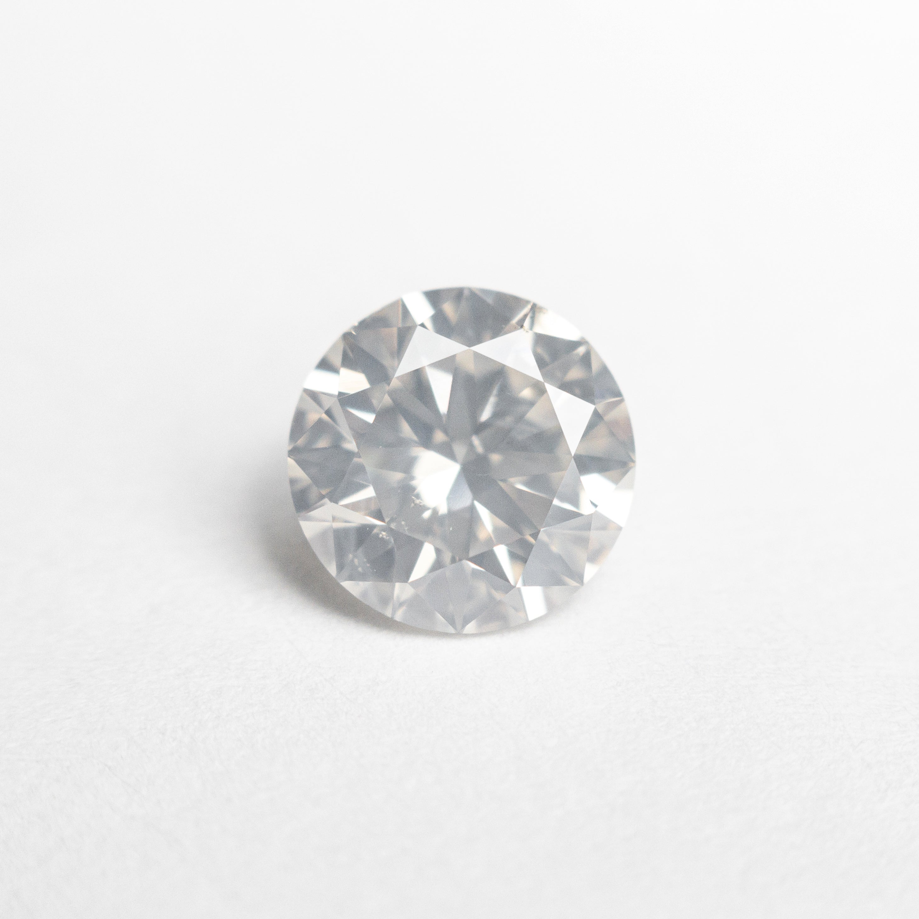 The 1.20ct 6.87x6.85x4.12mm SI1 Fancy White Round Brilliant 22352-01 by East London jeweller Rachel Boston | Discover our collections of unique and timeless engagement rings, wedding rings, and modern fine jewellery.