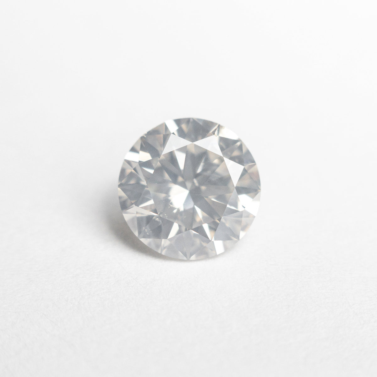 The 1.20ct 6.87x6.85x4.12mm SI1 Fancy White Round Brilliant 22352-01 by East London jeweller Rachel Boston | Discover our collections of unique and timeless engagement rings, wedding rings, and modern fine jewellery.