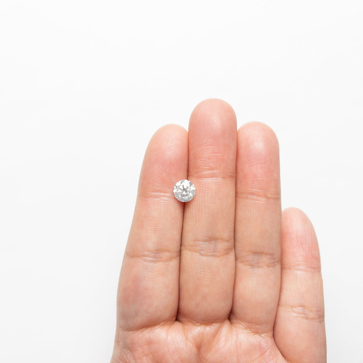 The 1.20ct 6.87x6.85x4.12mm SI1 Fancy White Round Brilliant 22352-01 by East London jeweller Rachel Boston | Discover our collections of unique and timeless engagement rings, wedding rings, and modern fine jewellery.
