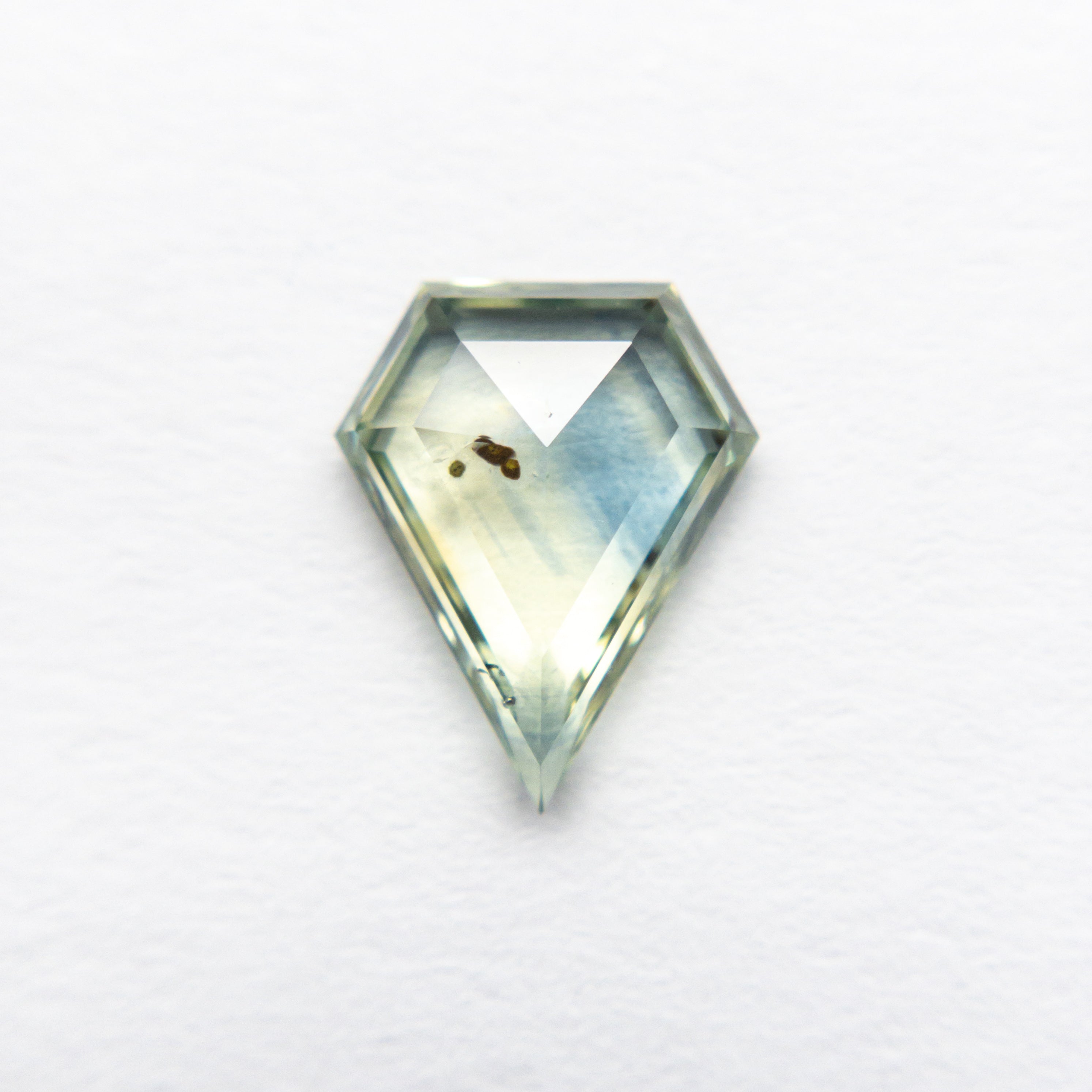 The 1.36ct 9.08x7.23x 2.51mm Shield Rosecut Sapphire 22434-08 by East London jeweller Rachel Boston | Discover our collections of unique and timeless engagement rings, wedding rings, and modern fine jewellery.