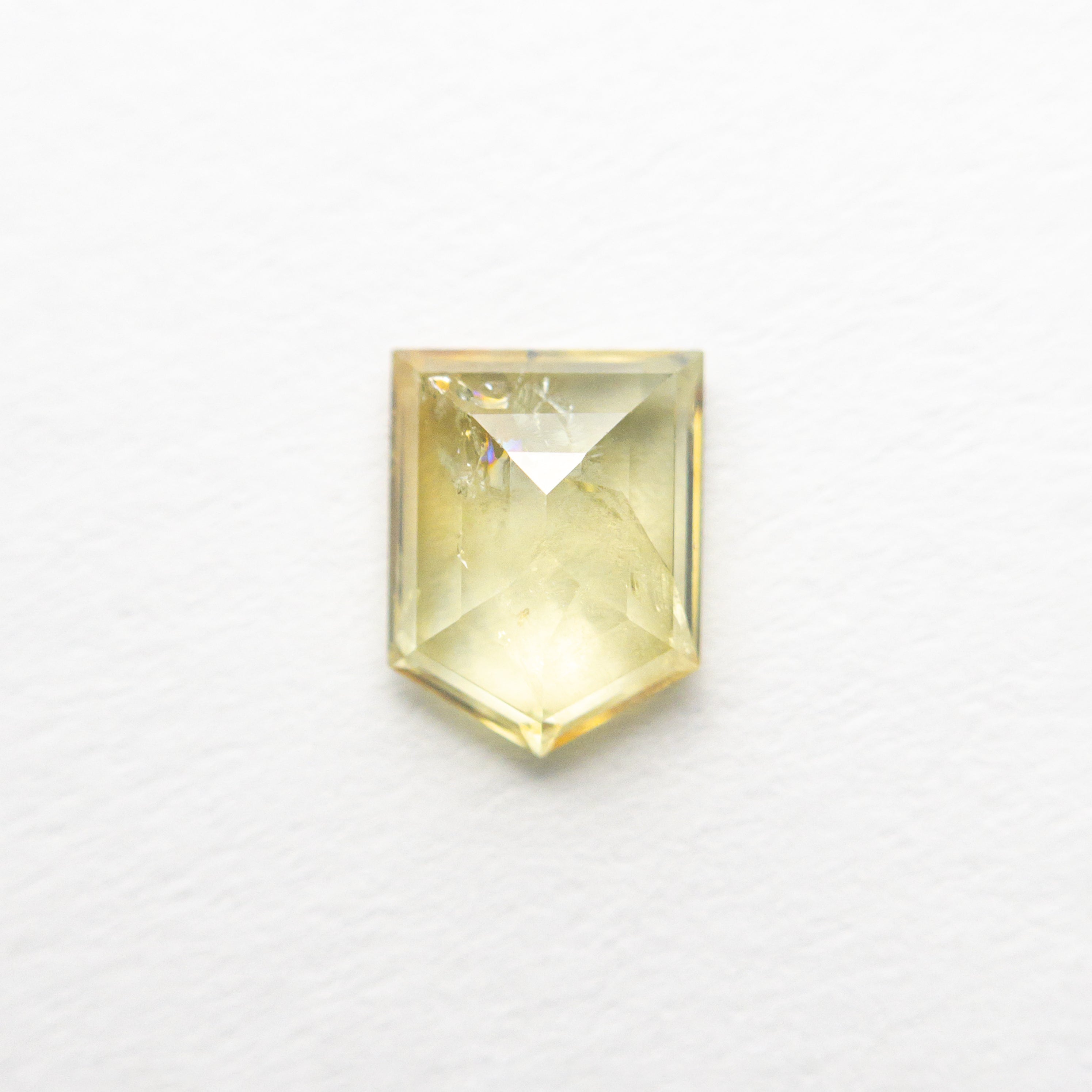 The 0.85ct 6.31x4.87x2.54mm Shield Rosecut Sapphire 22434-115 by East London jeweller Rachel Boston | Discover our collections of unique and timeless engagement rings, wedding rings, and modern fine jewellery.