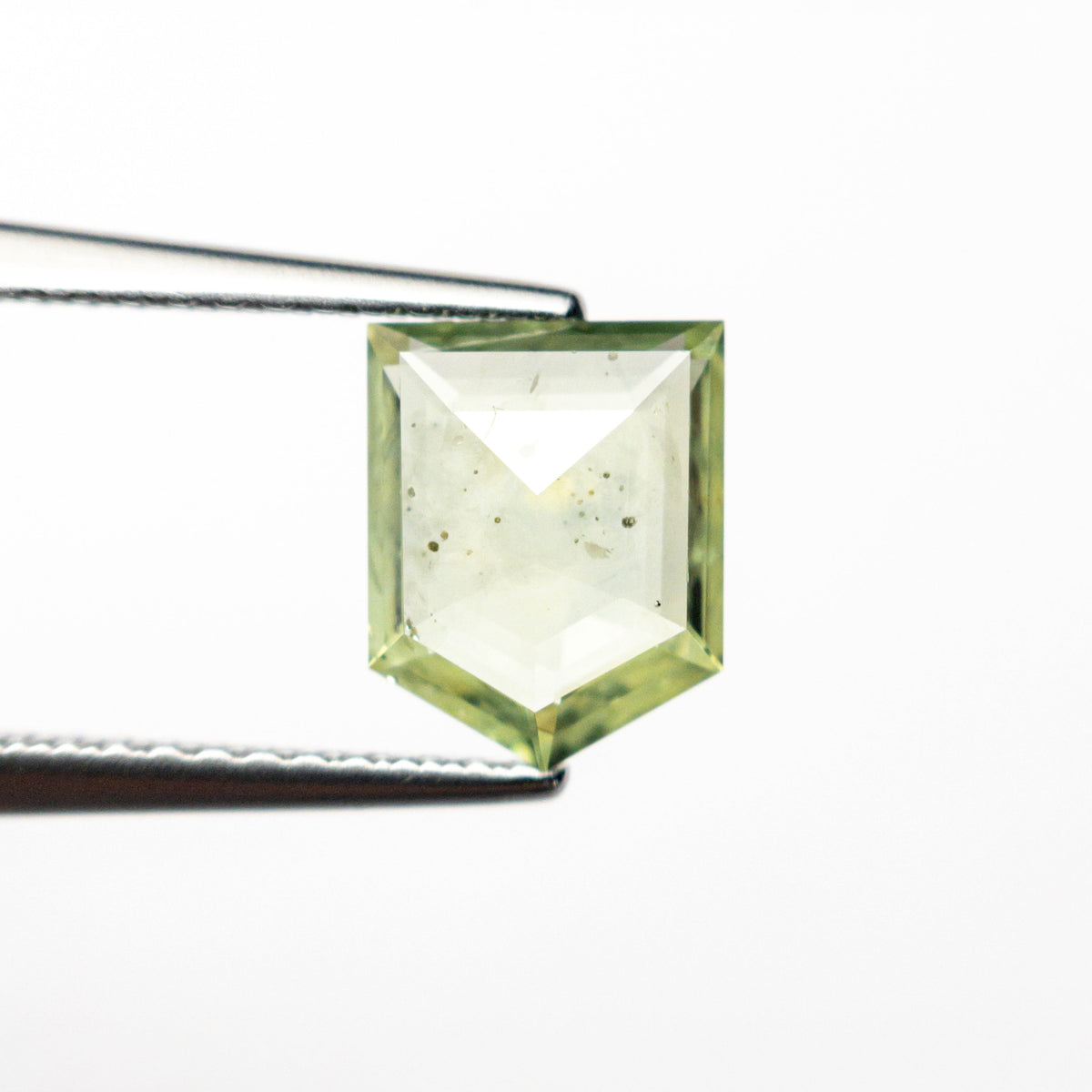 The 1.46ct 8.02x6.41x2.51mm Pentagon Rosecut Sapphire 22434-129 by East London jeweller Rachel Boston | Discover our collections of unique and timeless engagement rings, wedding rings, and modern fine jewellery.