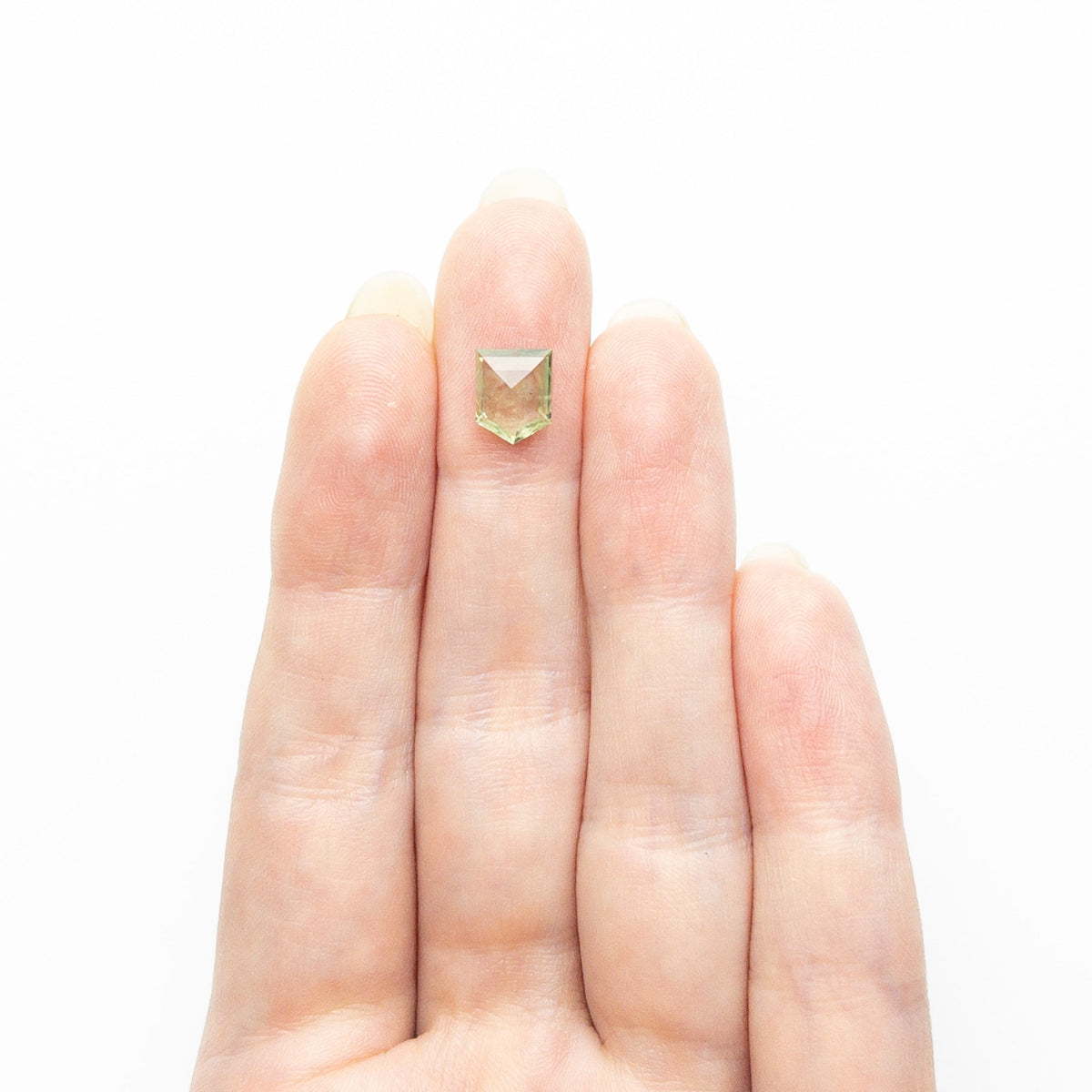 The 1.46ct 8.02x6.41x2.51mm Pentagon Rosecut Sapphire 22434-129 by East London jeweller Rachel Boston | Discover our collections of unique and timeless engagement rings, wedding rings, and modern fine jewellery.