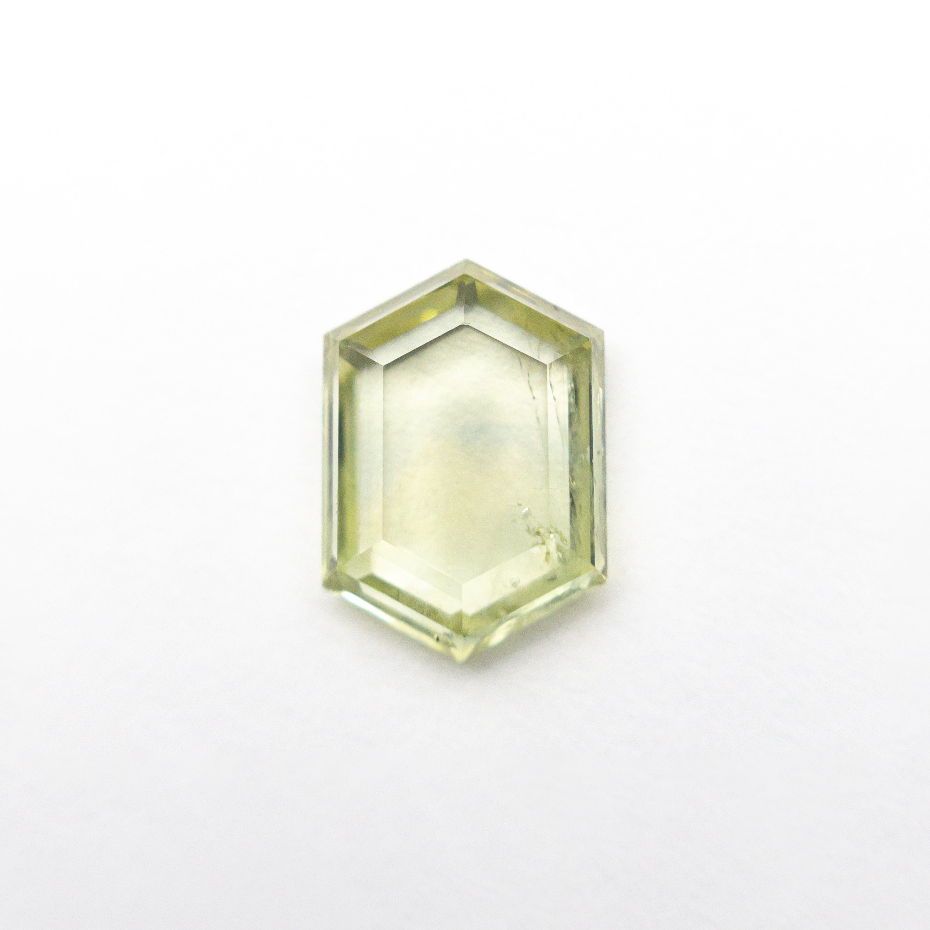 The 1.47ct 8.55x6.07x2.35mm Hexagon Portrait Cut Sapphire 22434-133 by East London jeweller Rachel Boston | Discover our collections of unique and timeless engagement rings, wedding rings, and modern fine jewellery.