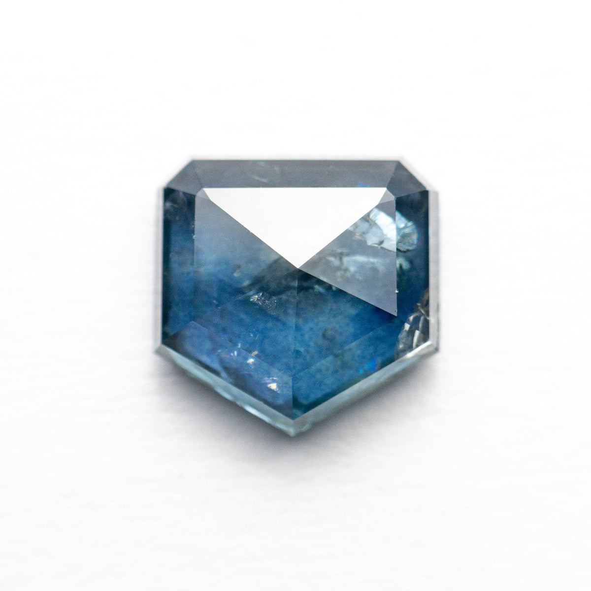 The 2.67ct 7.99x8.04x3.67mm Shield Rosecut Sapphire 22434-52 by East London jeweller Rachel Boston | Discover our collections of unique and timeless engagement rings, wedding rings, and modern fine jewellery.
