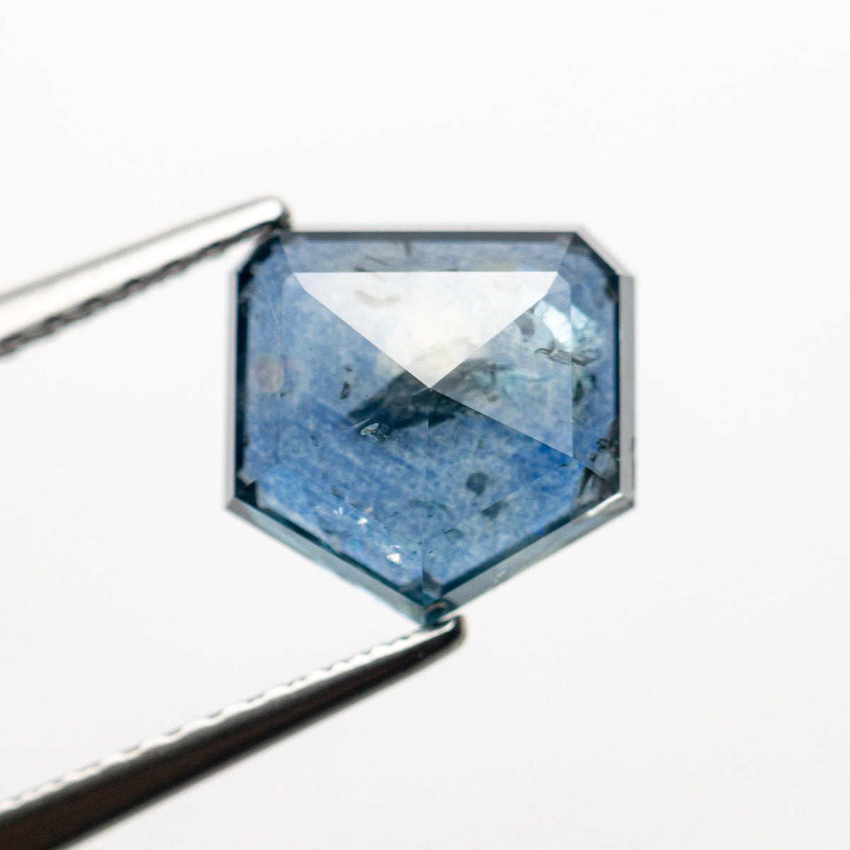 The 2.67ct 7.99x8.04x3.67mm Shield Rosecut Sapphire 22434-52 by East London jeweller Rachel Boston | Discover our collections of unique and timeless engagement rings, wedding rings, and modern fine jewellery.