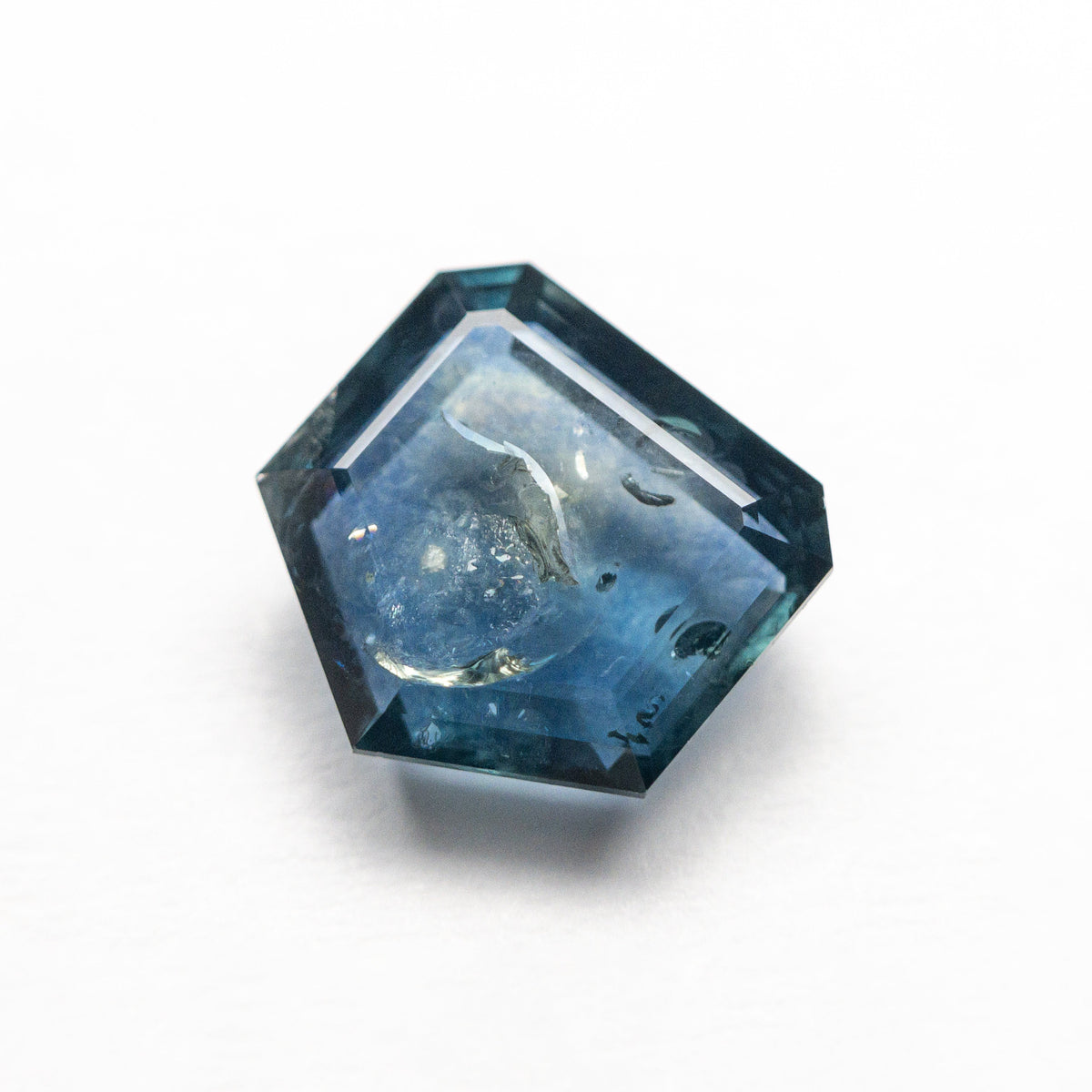 The 2.67ct 7.99x8.04x3.67mm Shield Rosecut Sapphire 22434-52 by East London jeweller Rachel Boston | Discover our collections of unique and timeless engagement rings, wedding rings, and modern fine jewellery.