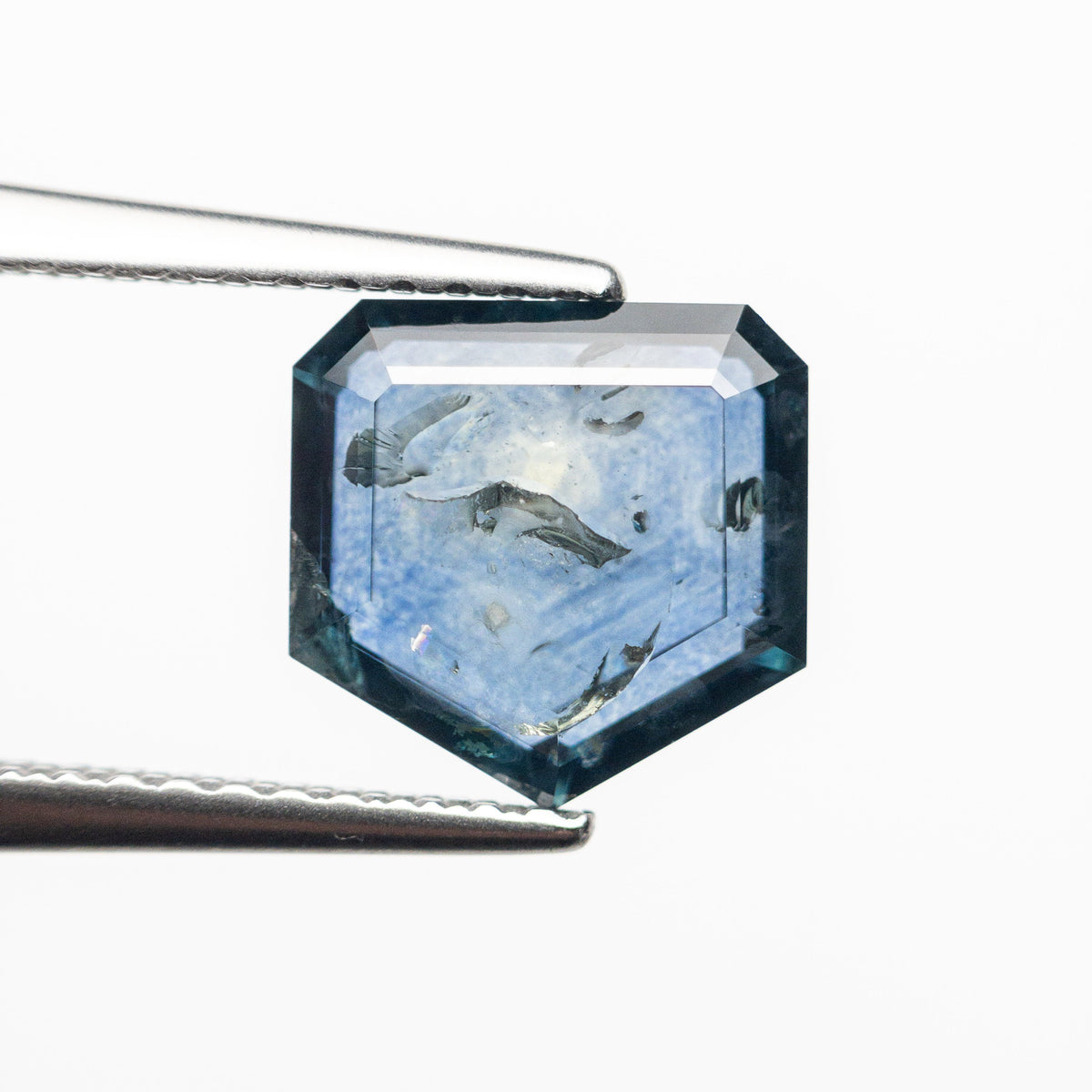 The 2.67ct 7.99x8.04x3.67mm Shield Rosecut Sapphire 22434-52 by East London jeweller Rachel Boston | Discover our collections of unique and timeless engagement rings, wedding rings, and modern fine jewellery.