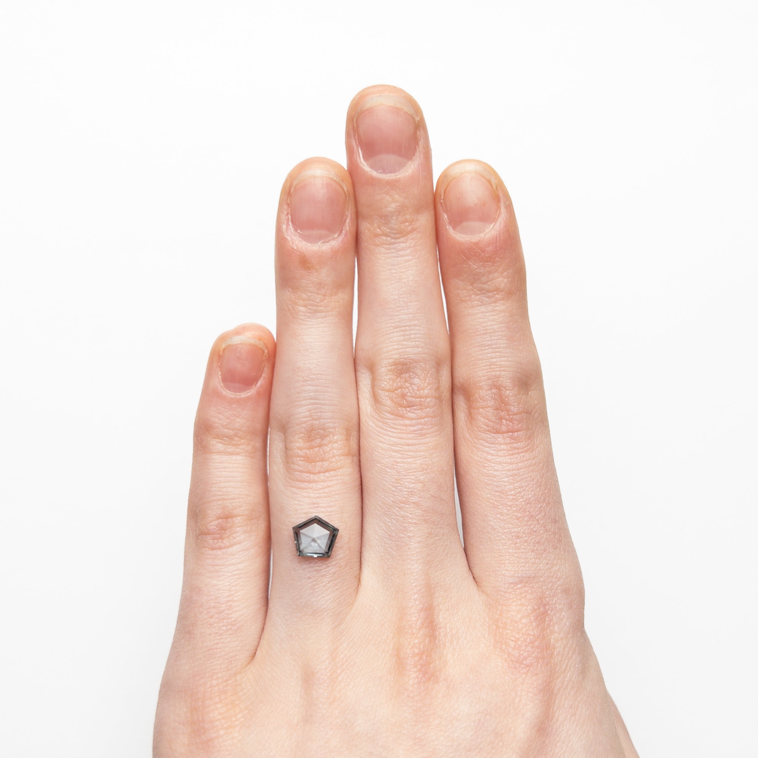 The 1.29ct 7.37x6.51x2.81mm Pentagon Double Cut Sapphire 22434-57 by East London jeweller Rachel Boston | Discover our collections of unique and timeless engagement rings, wedding rings, and modern fine jewellery.
