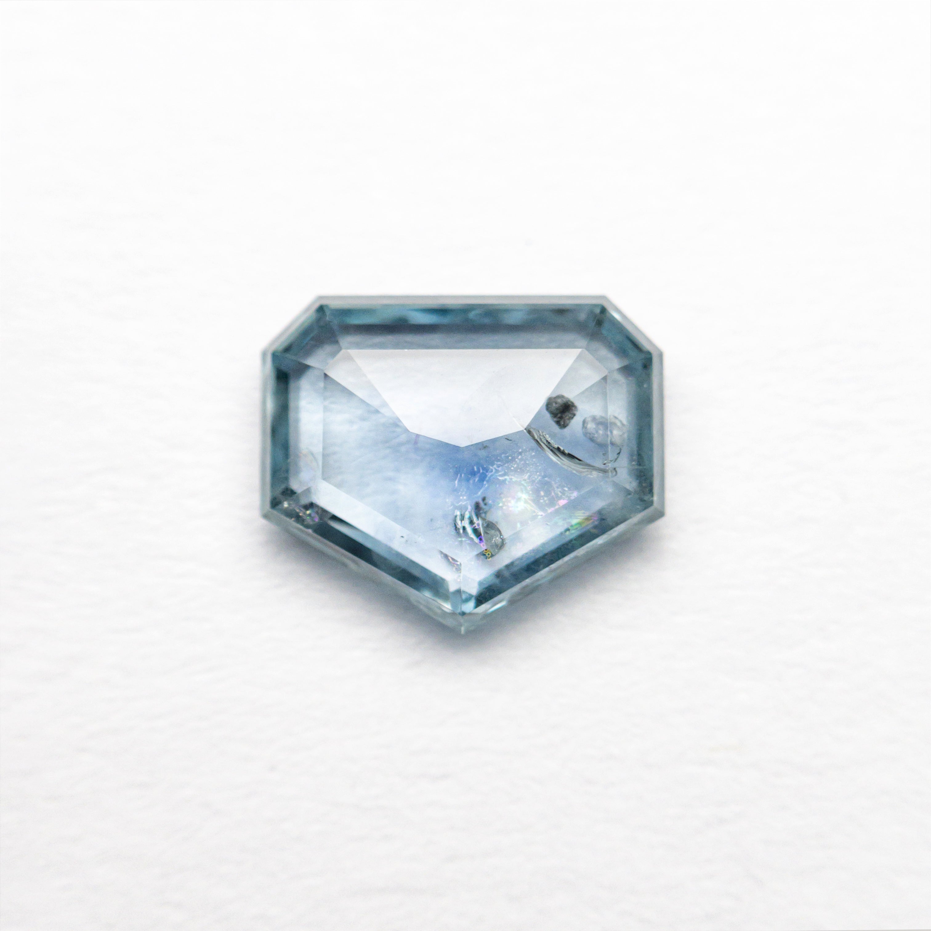 The 1.23ct 7.34x6.15x2.28mm Shield Rosecut Sapphire 22434-62 by East London jeweller Rachel Boston | Discover our collections of unique and timeless engagement rings, wedding rings, and modern fine jewellery.