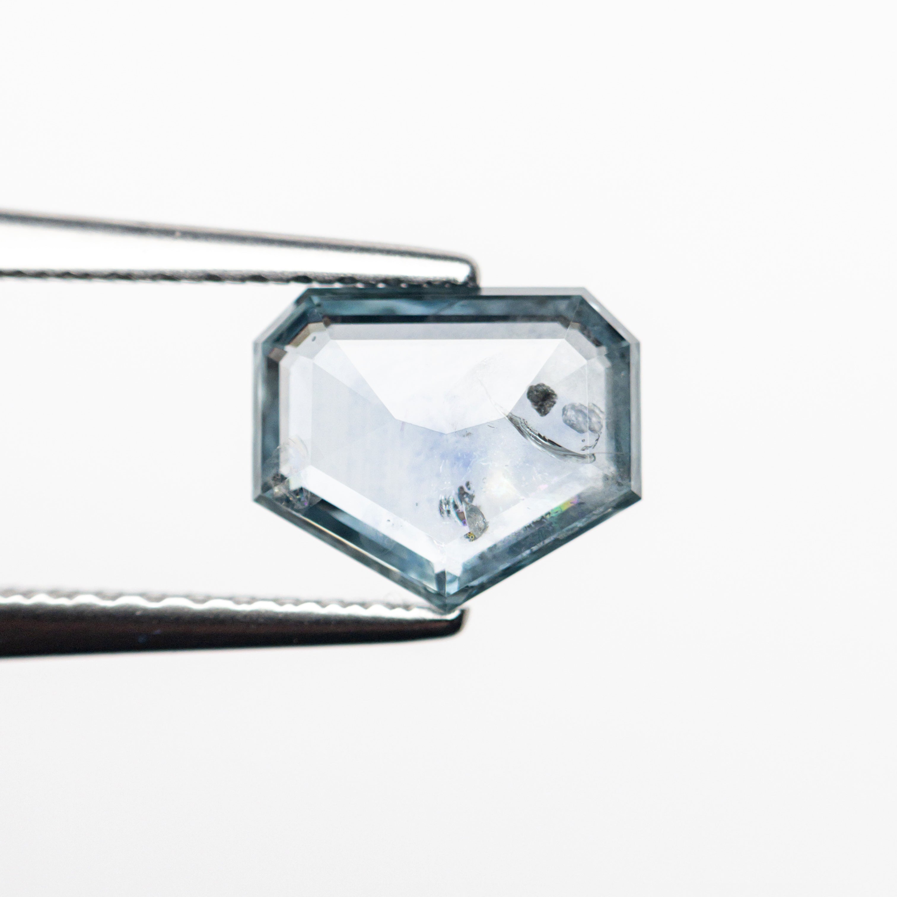 The 1.23ct 7.34x6.15x2.28mm Shield Rosecut Sapphire 22434-62 by East London jeweller Rachel Boston | Discover our collections of unique and timeless engagement rings, wedding rings, and modern fine jewellery.