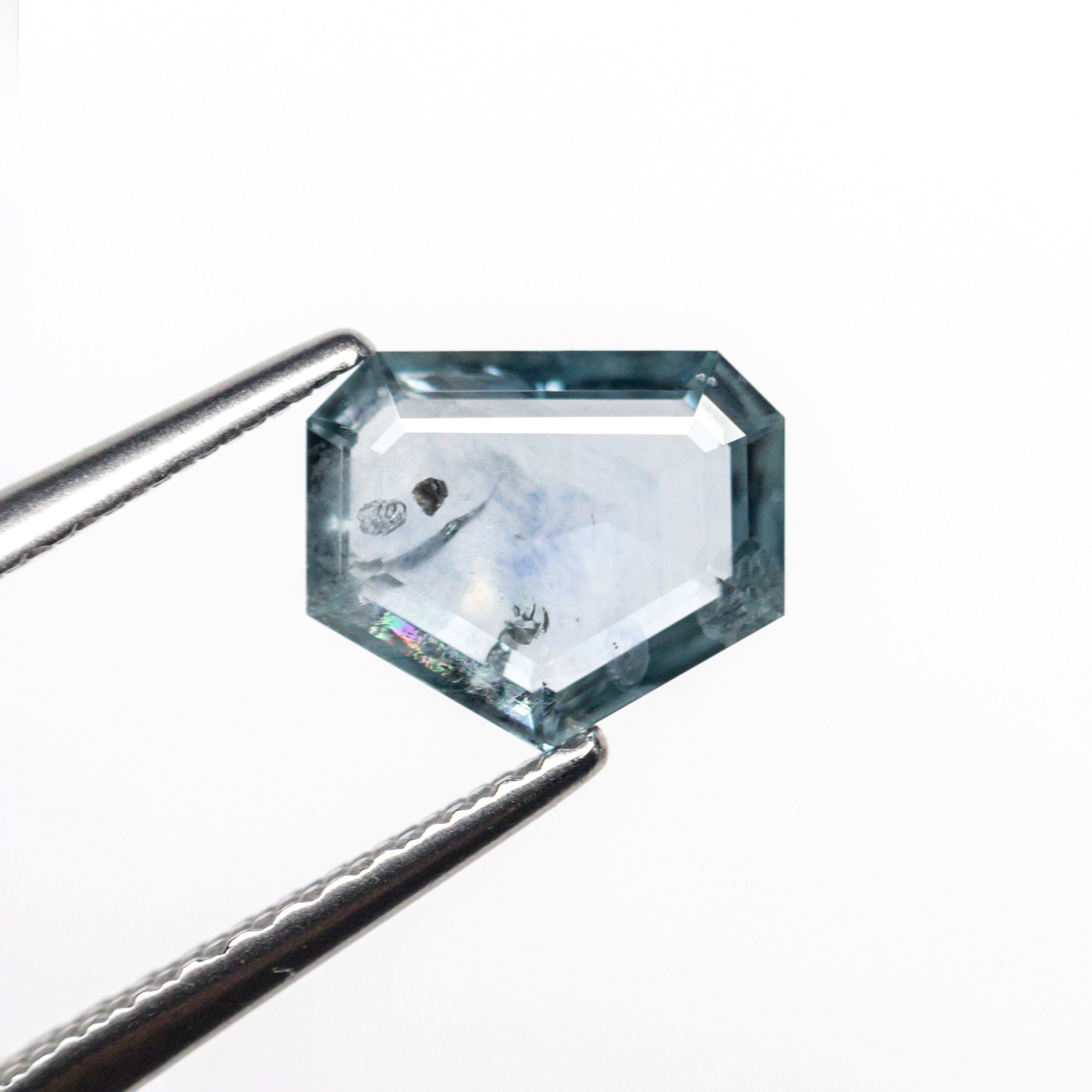 The 1.23ct 7.34x6.15x2.28mm Shield Rosecut Sapphire 22434-62 by East London jeweller Rachel Boston | Discover our collections of unique and timeless engagement rings, wedding rings, and modern fine jewellery.