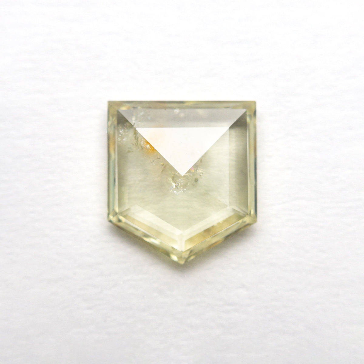 The 1.36ct 7.51x6.69x2.25mm Shield Double Cut Sapphire 22434-75 by East London jeweller Rachel Boston | Discover our collections of unique and timeless engagement rings, wedding rings, and modern fine jewellery.