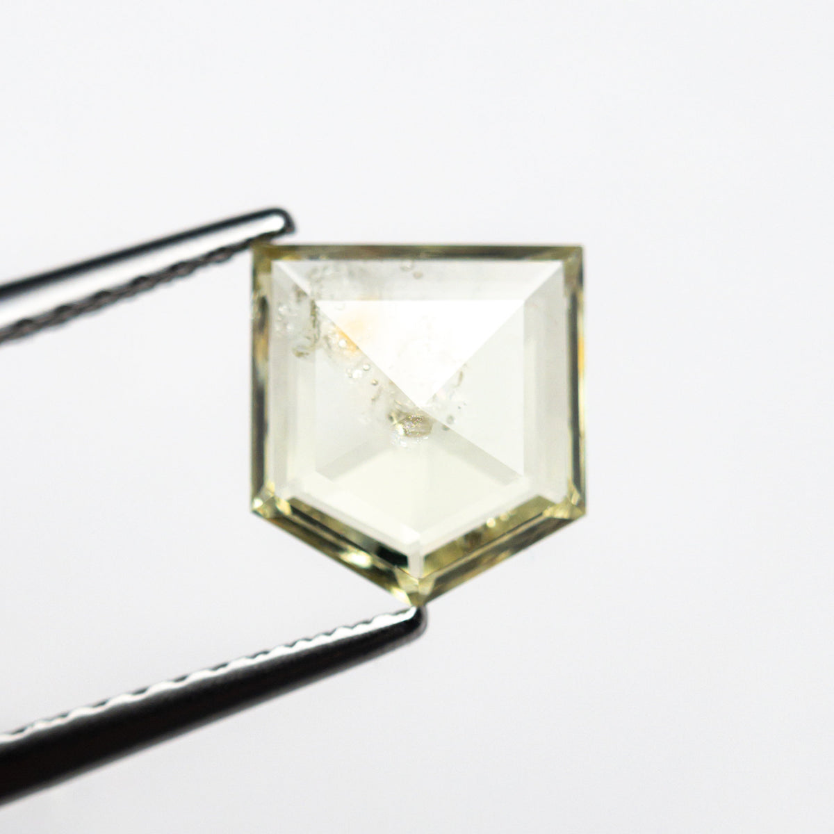 The 1.36ct 7.51x6.69x2.25mm Shield Double Cut Sapphire 22434-75 by East London jeweller Rachel Boston | Discover our collections of unique and timeless engagement rings, wedding rings, and modern fine jewellery.