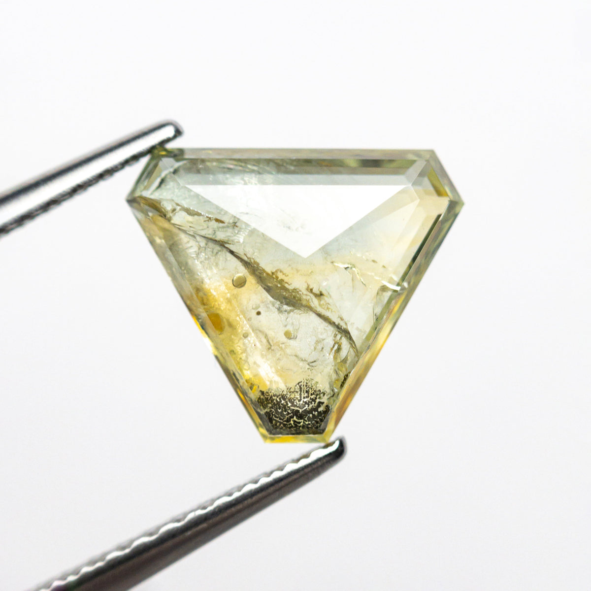The 1.99ct 8.35x9.64x2.72mm Cut Corner Triangle Rosecut Sapphire 22434-77 by East London jeweller Rachel Boston | Discover our collections of unique and timeless engagement rings, wedding rings, and modern fine jewellery.