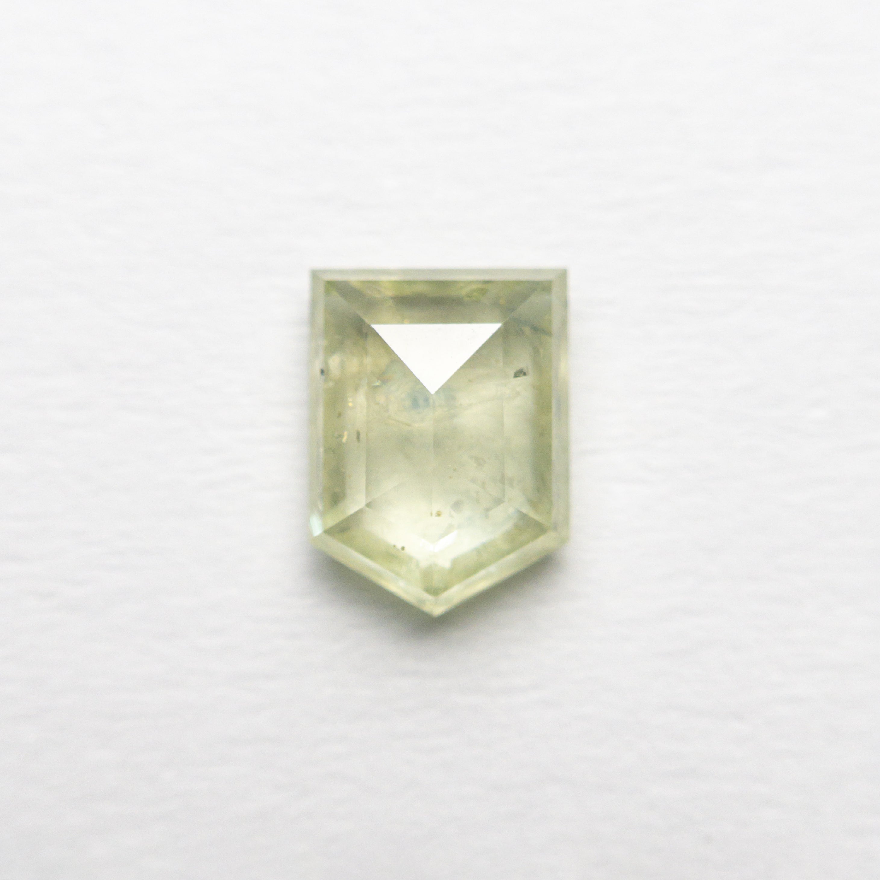 The 1.00ct 6.48x4.85x2.63mm Shield Double Cut Sapphire 22434-86 by East London jeweller Rachel Boston | Discover our collections of unique and timeless engagement rings, wedding rings, and modern fine jewellery.