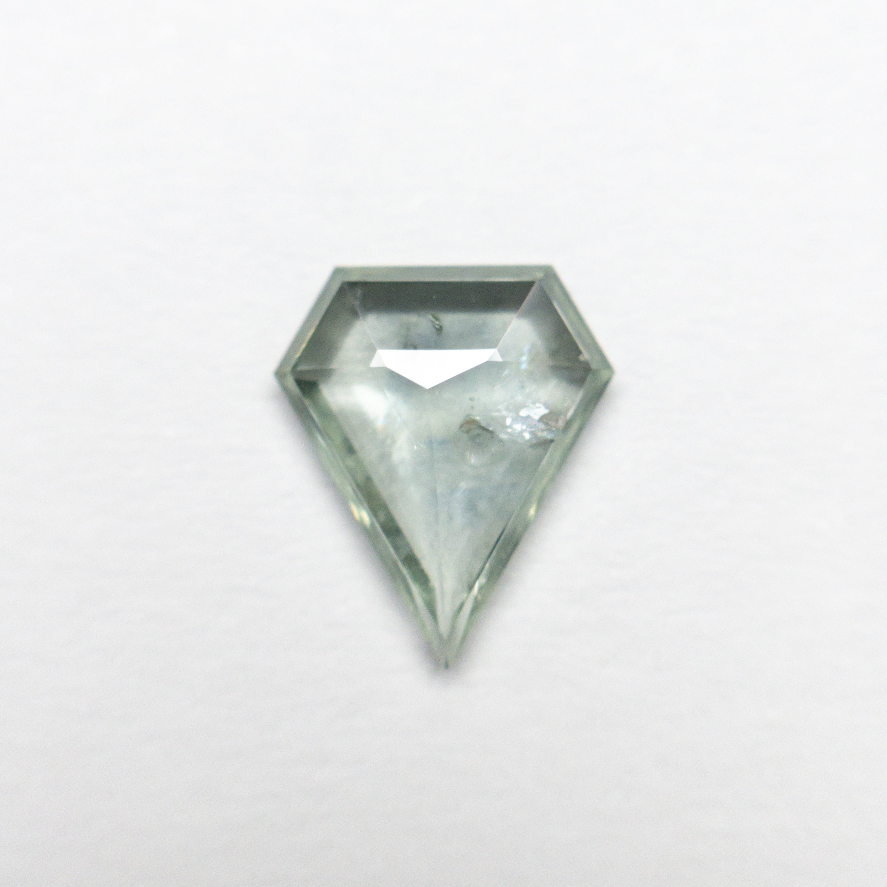 The 1.06ct 8.67x7.33x2.14mm Shield Rosecut Sapphire 22434-92 by East London jeweller Rachel Boston | Discover our collections of unique and timeless engagement rings, wedding rings, and modern fine jewellery.