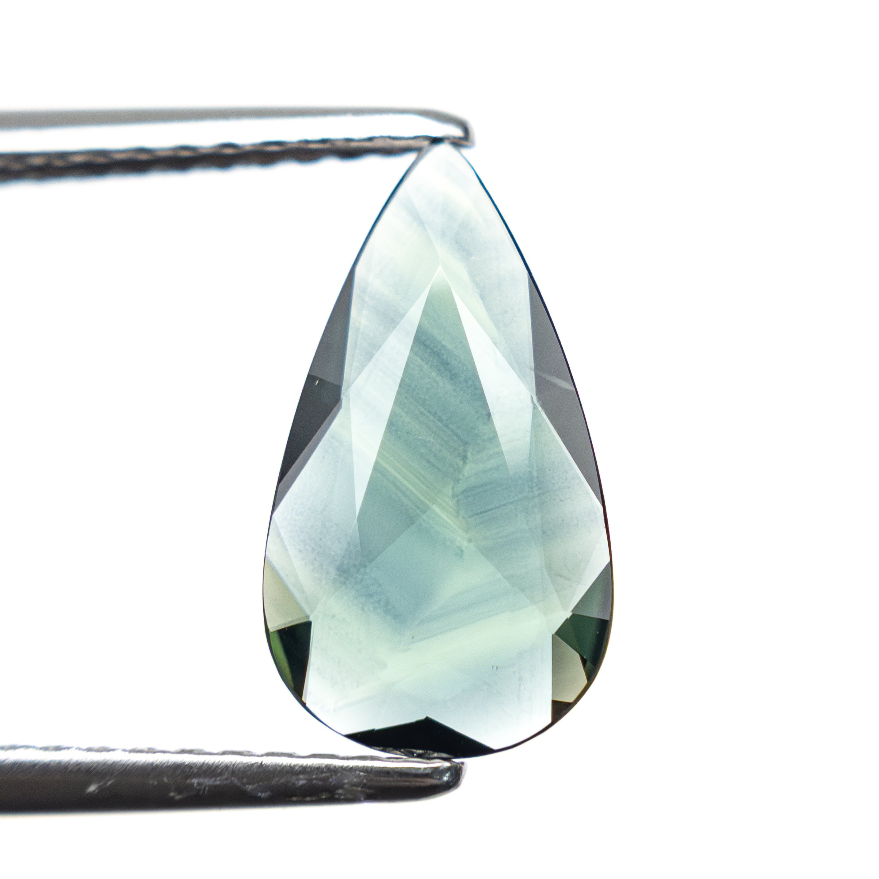 The 1.30ct 12.04x6.71x1.79mm Pear Rosecut Sapphire 22436-03 by East London jeweller Rachel Boston | Discover our collections of unique and timeless engagement rings, wedding rings, and modern fine jewellery.