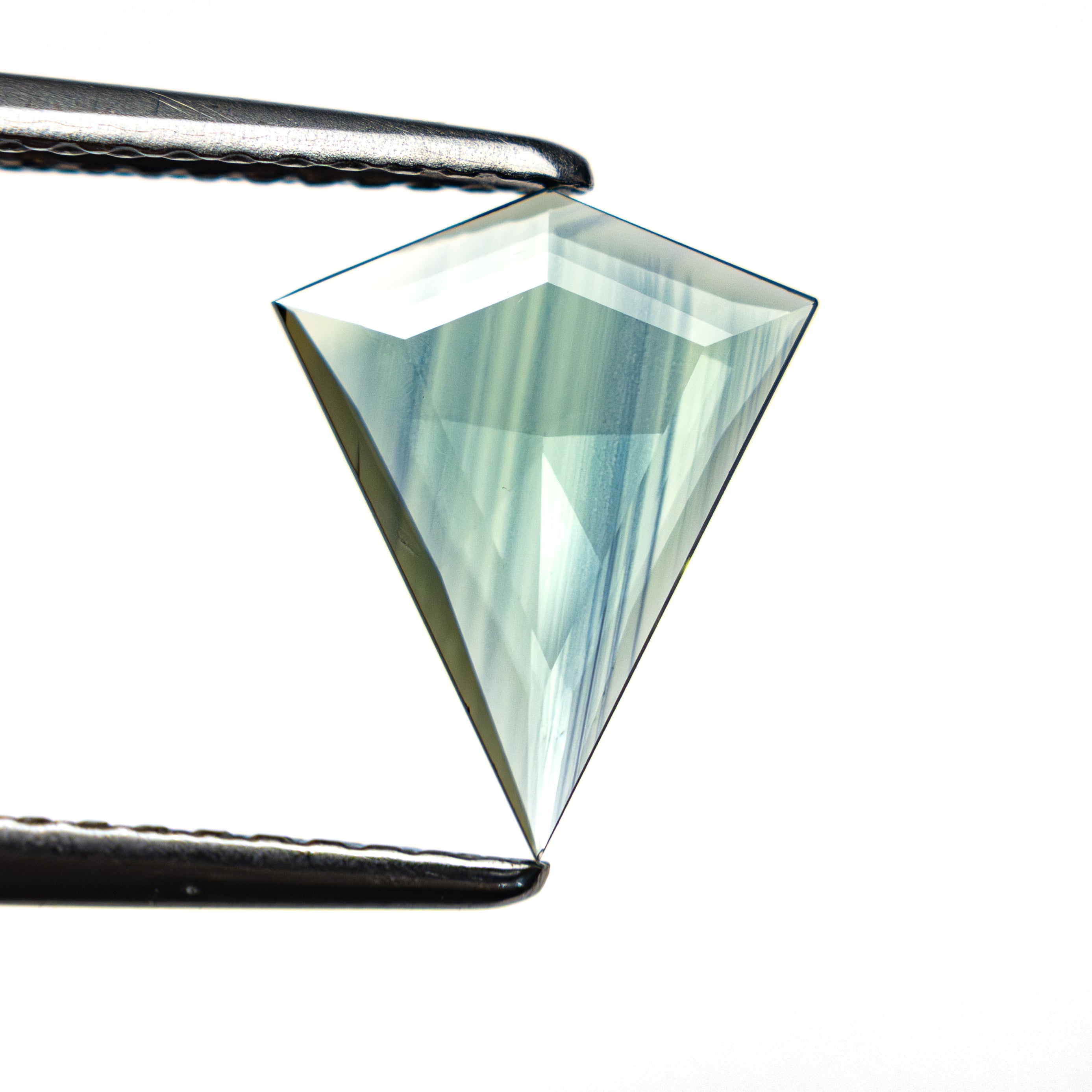 The 0.77ct 10.51x8.62x1.30mm Kite Rosecut Sapphire 22436-09 by East London jeweller Rachel Boston | Discover our collections of unique and timeless engagement rings, wedding rings, and modern fine jewellery.