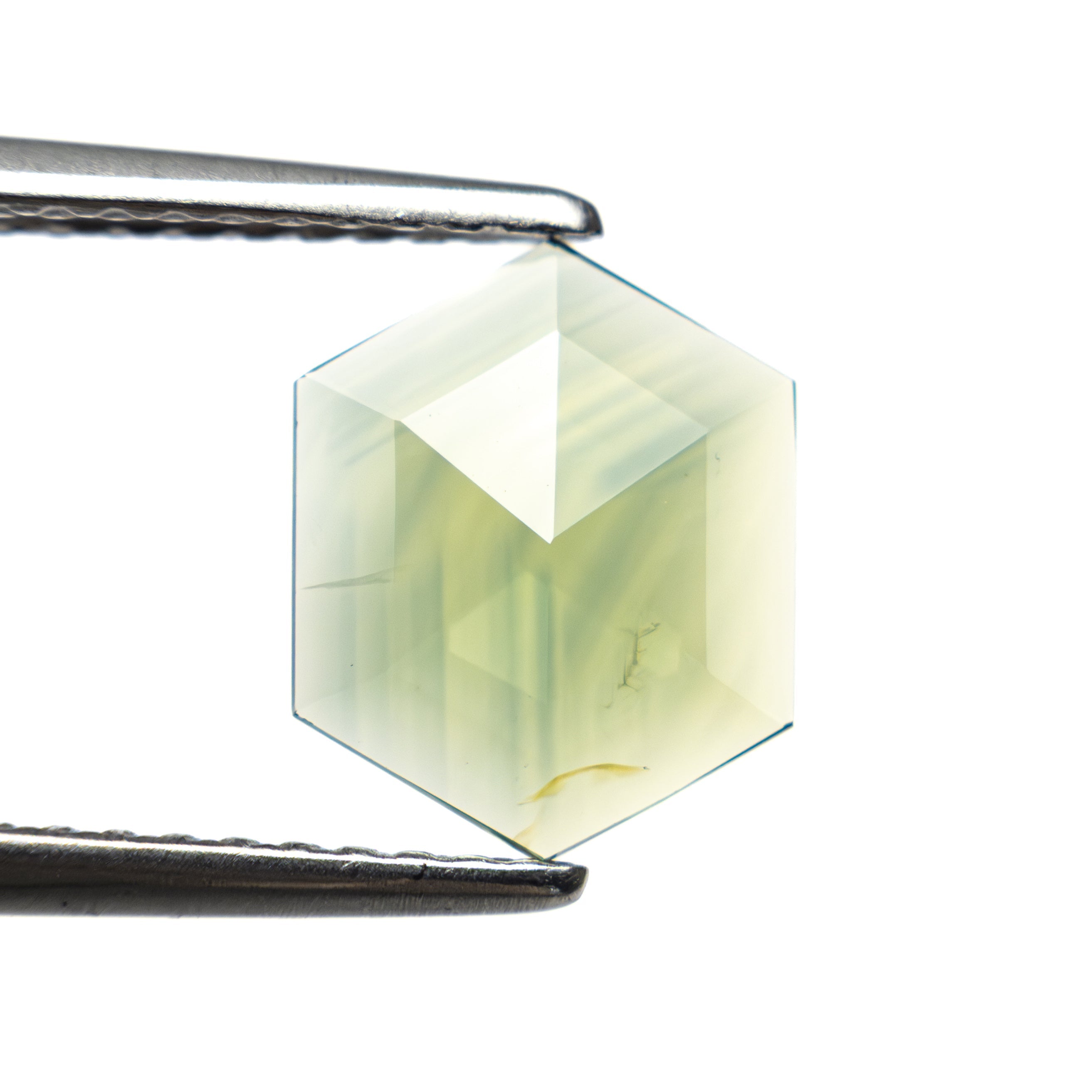 The 1.04ct 9.41x7.65x1.55mm Hexagon Rosecut Sapphire 22436-12 by East London jeweller Rachel Boston | Discover our collections of unique and timeless engagement rings, wedding rings, and modern fine jewellery.