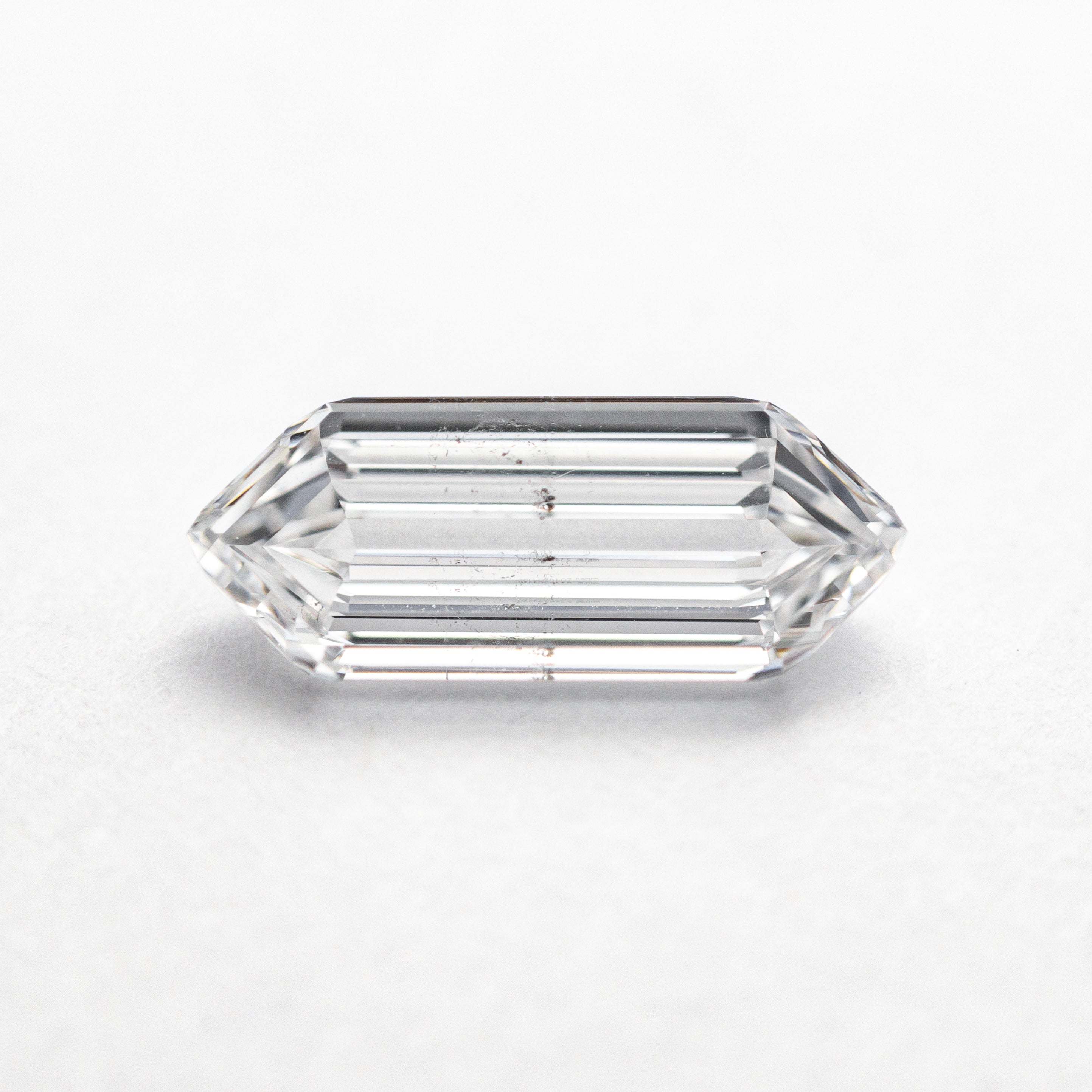 The 1.01ct 10.12x4.18x2.42mm GIA SI2 D Hexagon Step Cut 22621-01 by East London jeweller Rachel Boston | Discover our collections of unique and timeless engagement rings, wedding rings, and modern fine jewellery.