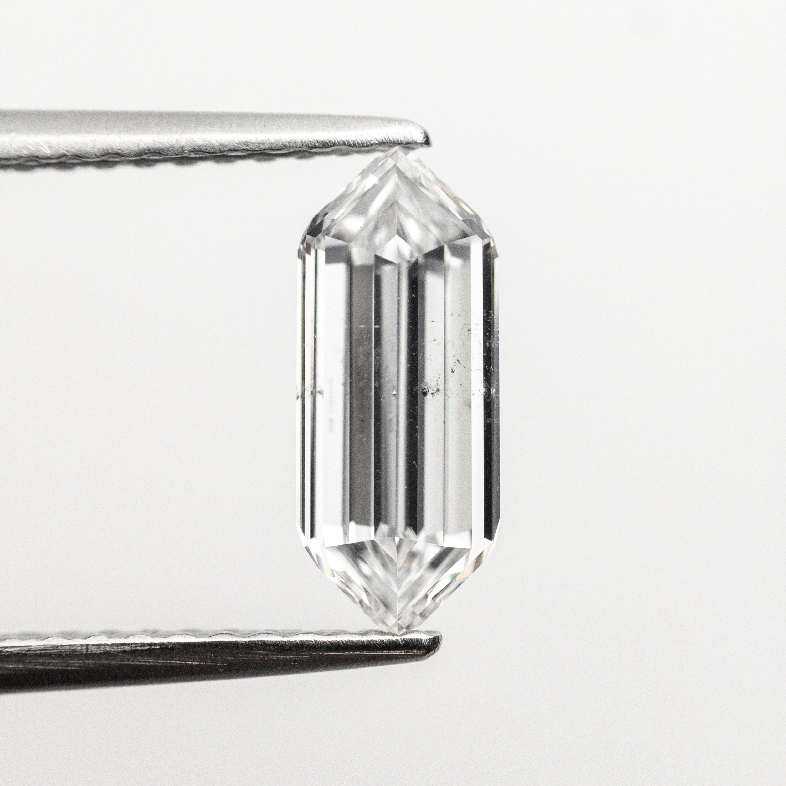 The 1.01ct 10.12x4.18x2.42mm GIA SI2 D Hexagon Step Cut 22621-01 by East London jeweller Rachel Boston | Discover our collections of unique and timeless engagement rings, wedding rings, and modern fine jewellery.